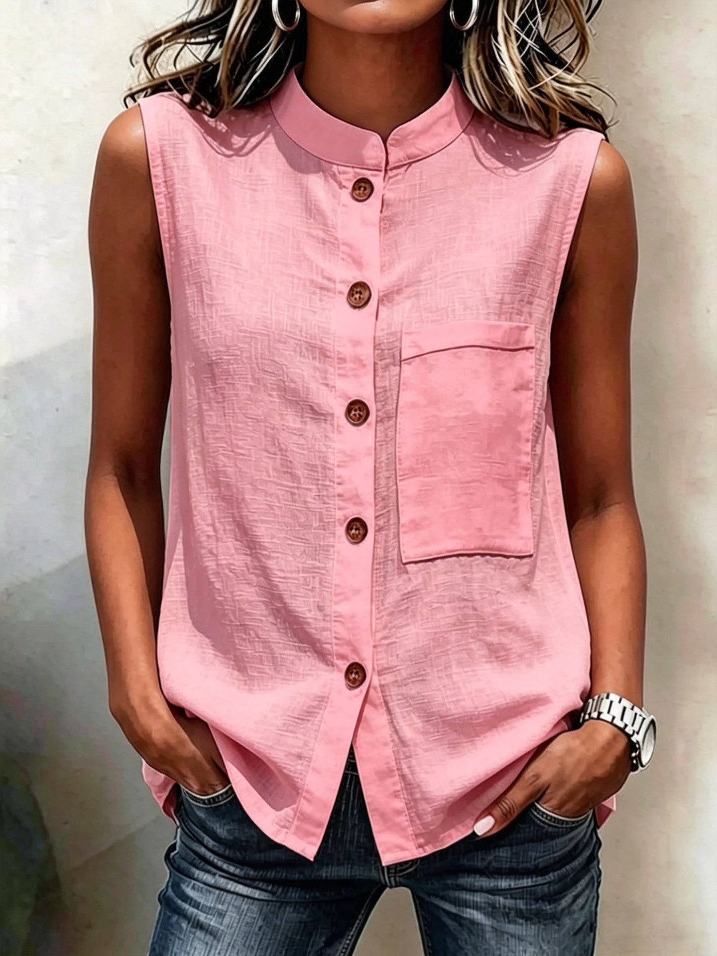 Women's sleeveless crop top by FitiqueFit featuring buttoned pockets, solid color casualwear, shown in a water-themed setting.