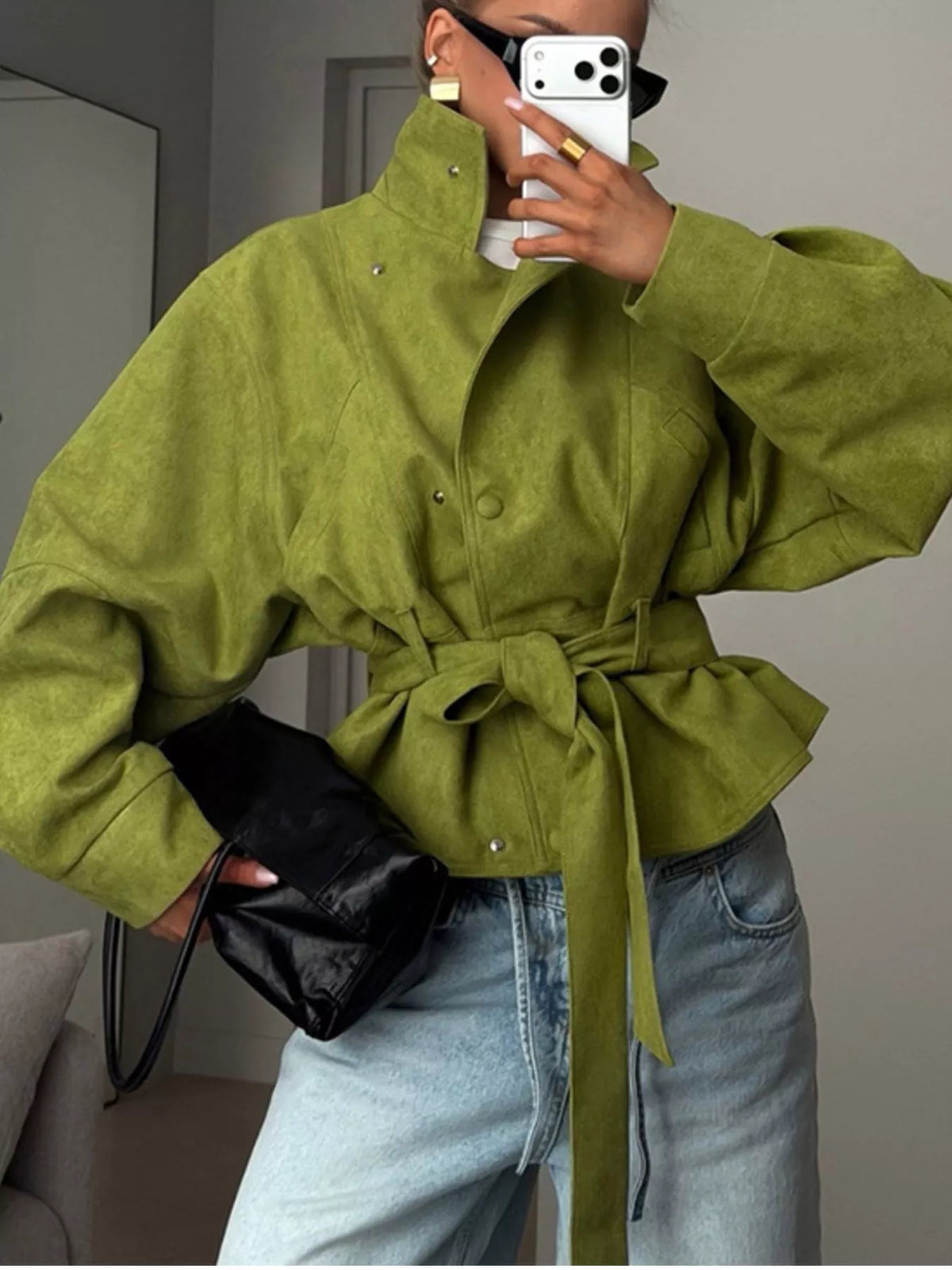 Women's tie waist long sleeve cropped jacket by Trendsi, featuring a stylish fitted design with a front tie and long sleeves.