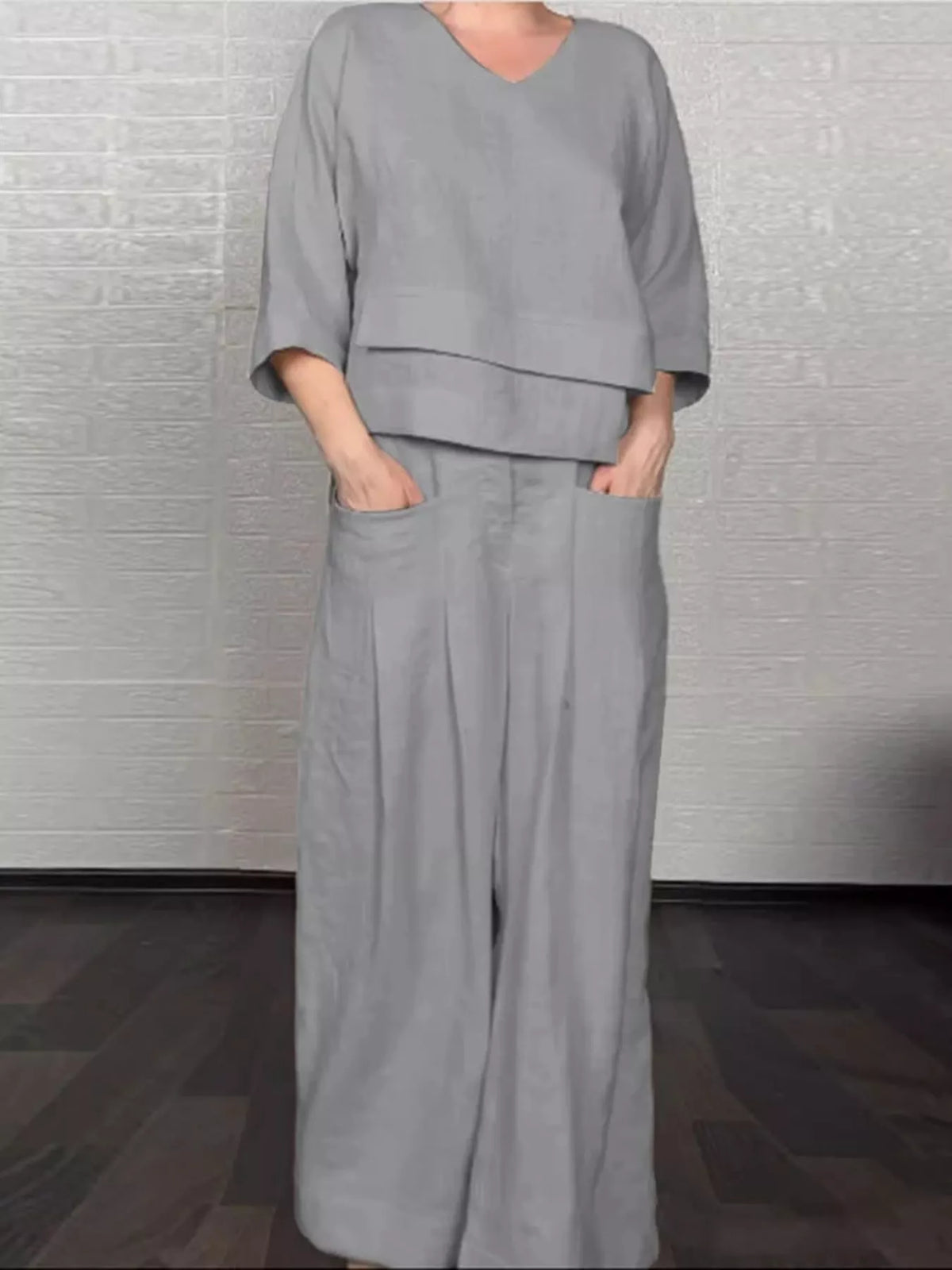 Plus size full V-neck long sleeve top and pants matching set by Trendsi, soft fabric, stylish and comfortable for casual wear.