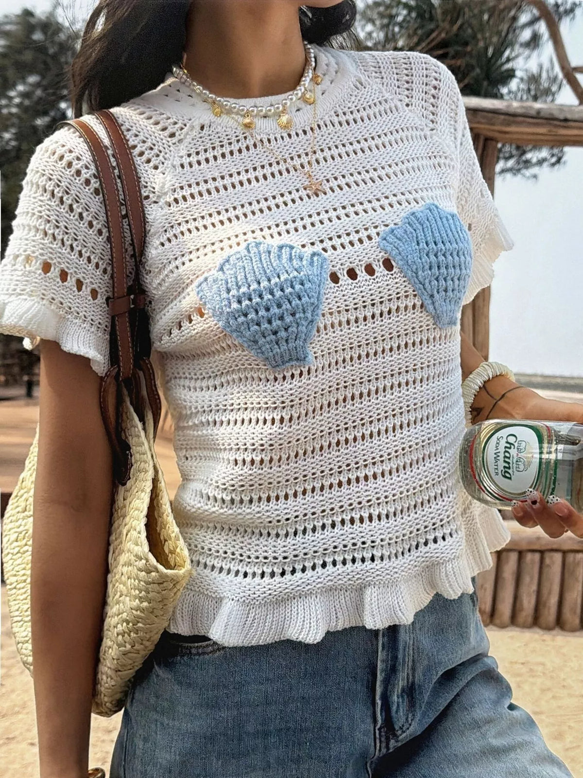 Openwork ruffled hem knit top by Plush Fashion Hub, featuring a stylish design with openwork details and ruffled hem.