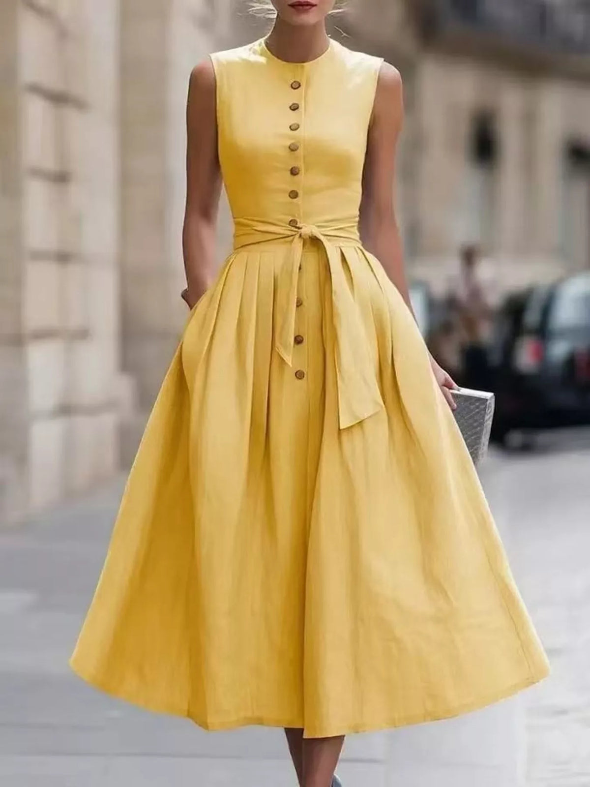 Plus size sleeveless button-front belted midi dress by Trendsi, shown in full view with a flowy silhouette and stylish design.