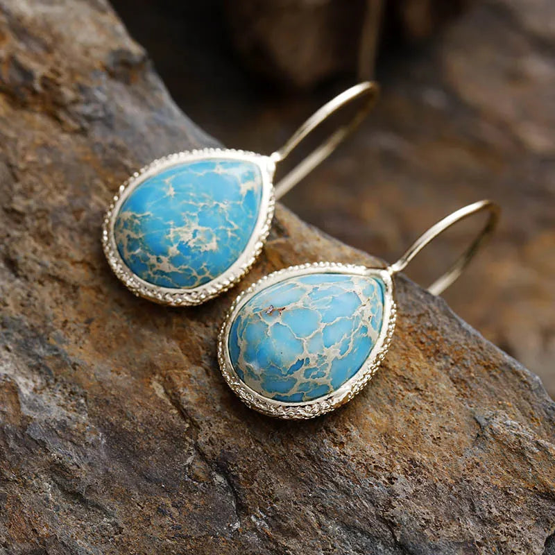Copper natural stone teardrop earrings with a polished finish, featuring a sleek and elegant design.