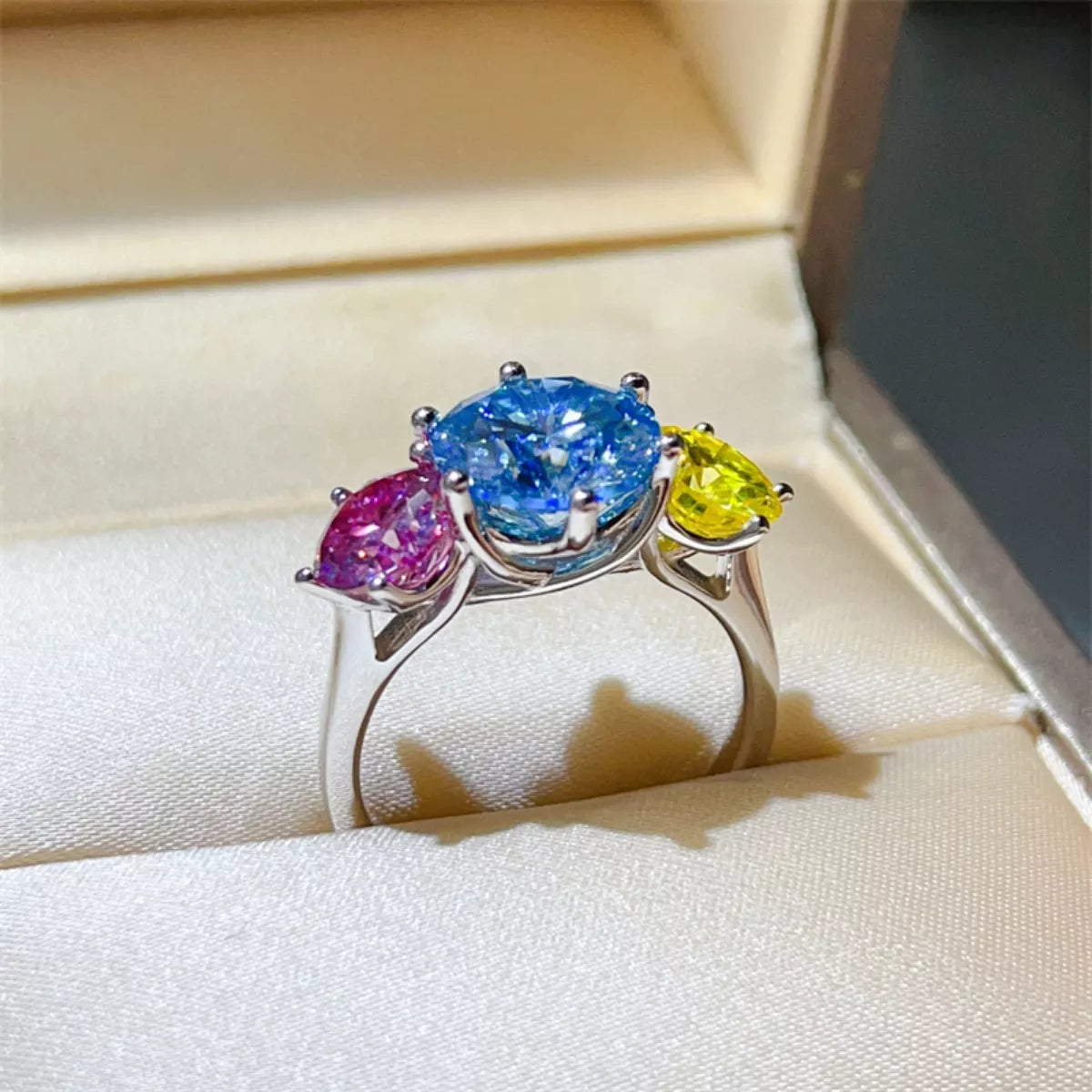 Sterling silver ring with a 5-carat moissanite gemstone, featuring a sleek band and sparkling center stone.