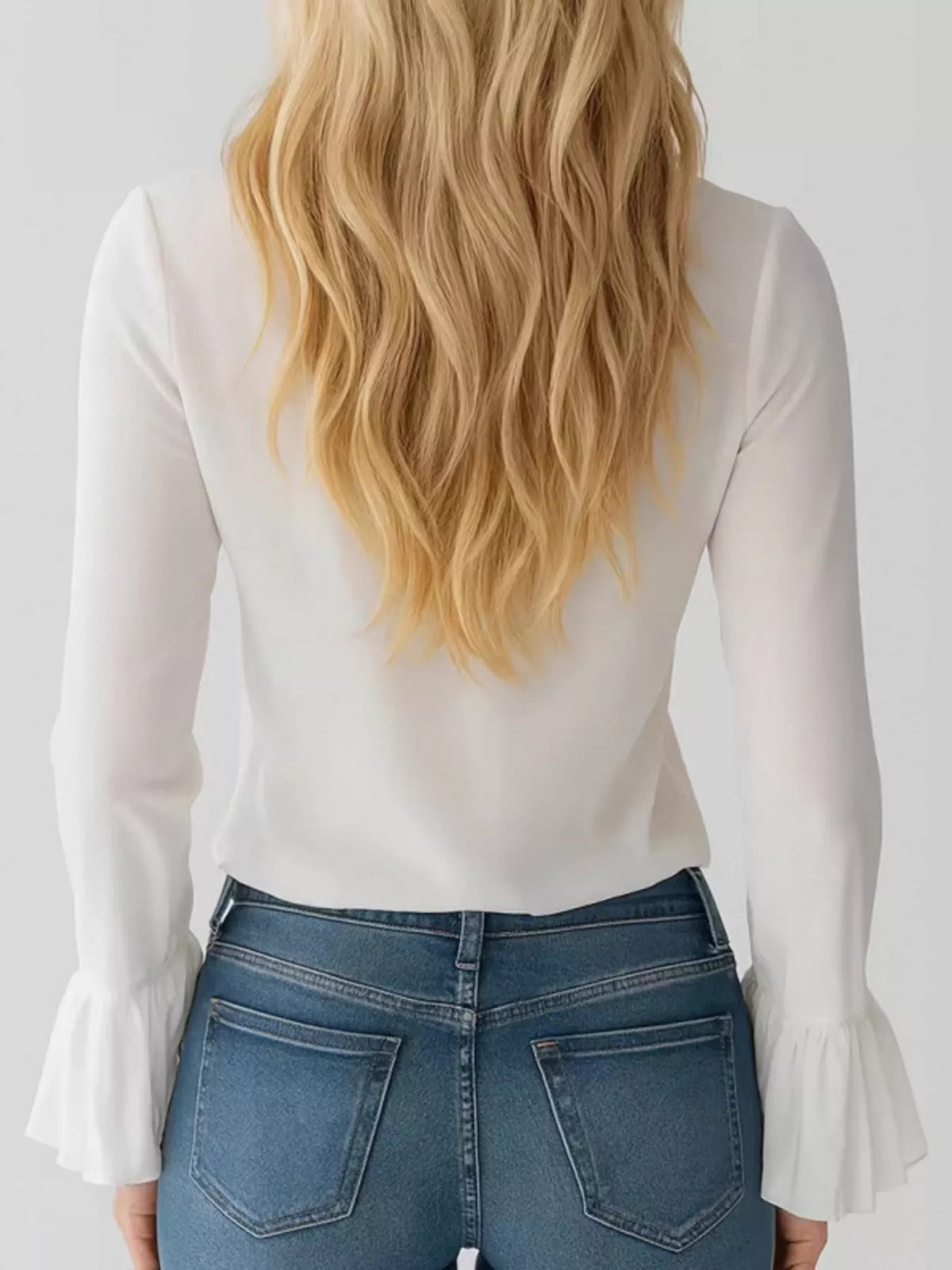 Women’s ruffled tie-front flare sleeve blouse by Trendsi, featuring elegant ruffles and a stylish tie detail in soft fabric.