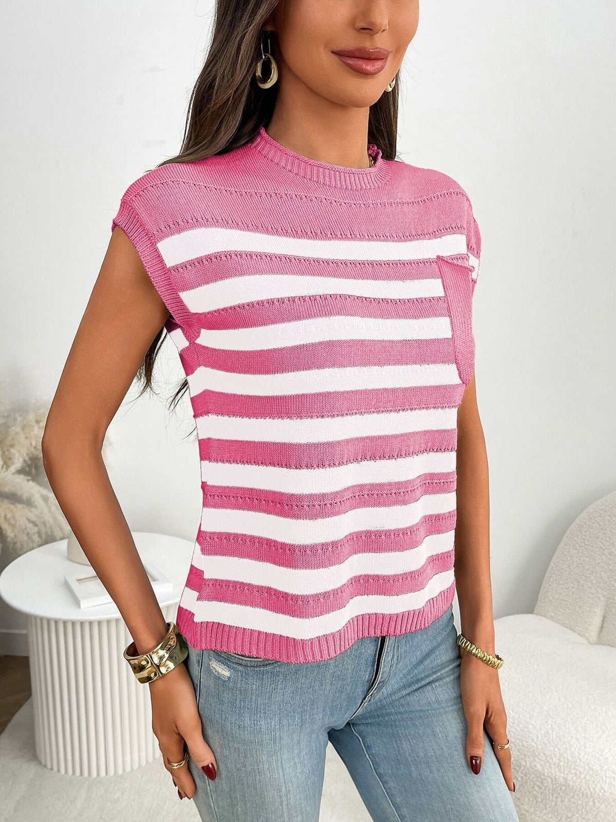 Women’s striped knit cap sleeve sweater with pocket detail, outerwear by Plush Fashion Hub, displayed on a hanger.