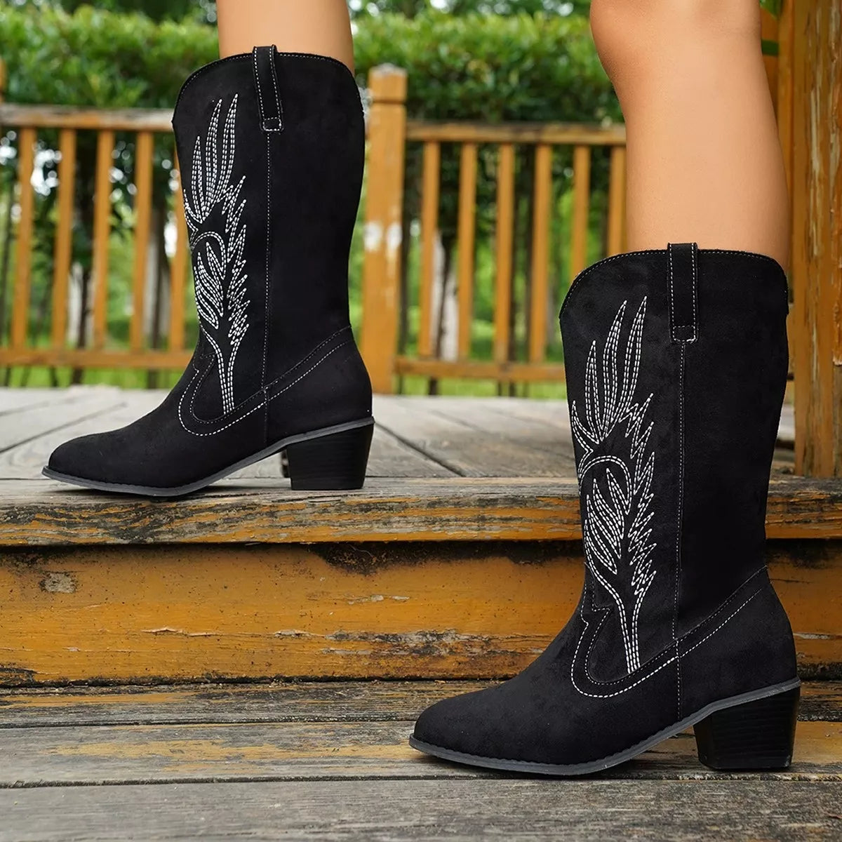 Point toe block heel boots by Trendsi featuring a sleek silhouette and stylish design, perfect for trendy fall or winter outfits.
