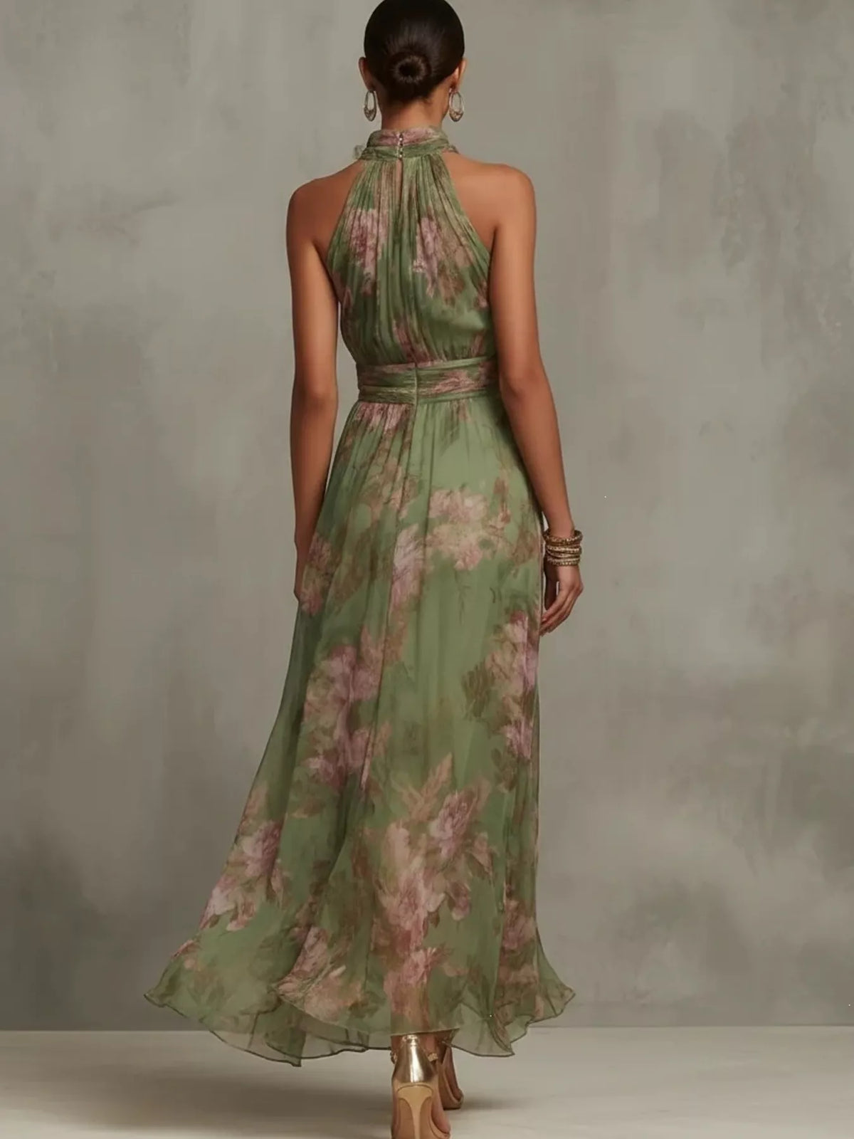 Plus size floral print sleeveless maxi dress by Trendsi, full-length view showcasing vibrant pattern and flowing fabric.