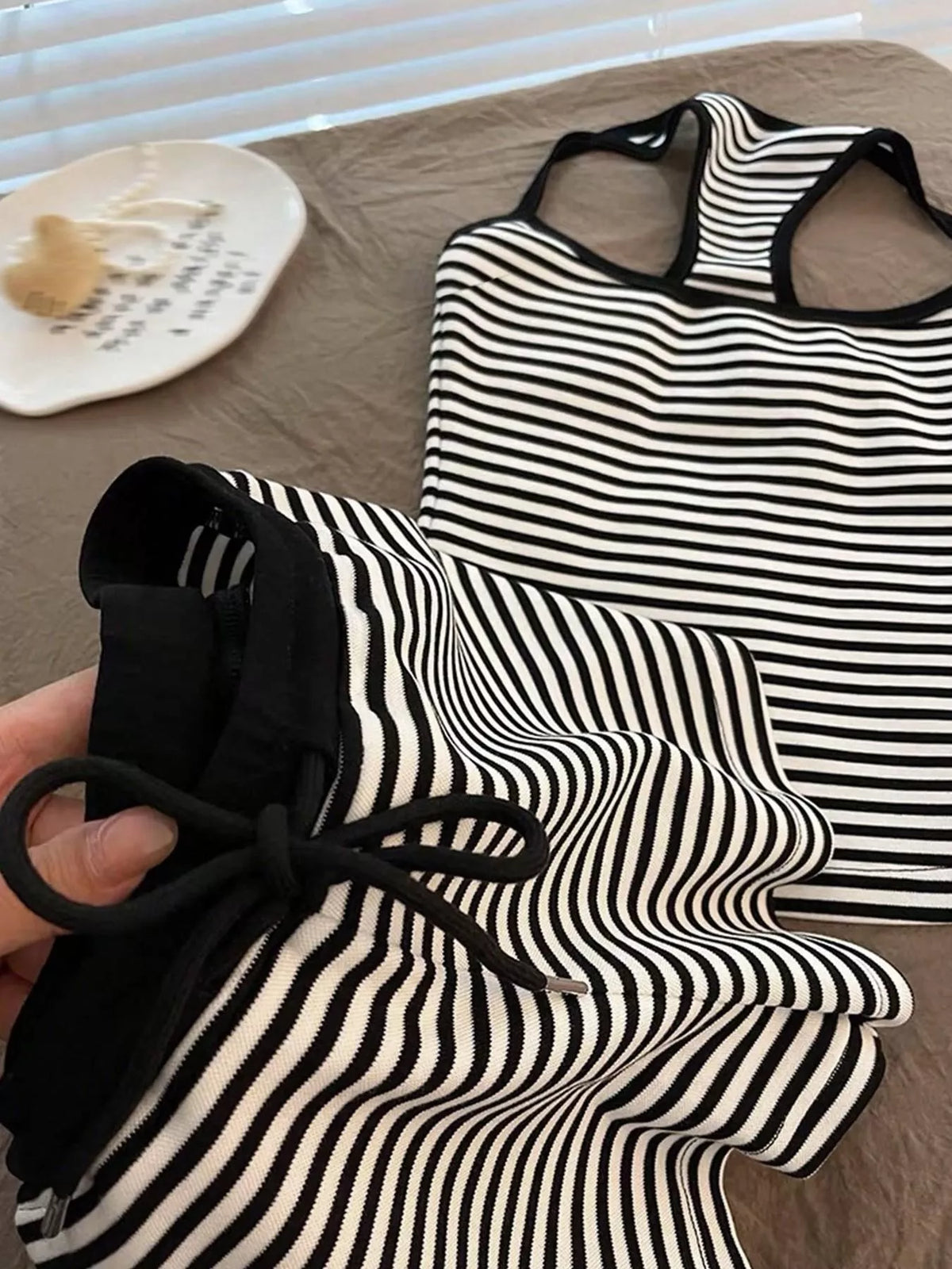 Striped tank top and shorts set by Plush Fashion Hub, featuring a casual summer look with comfortable fabric and colorful stripes.