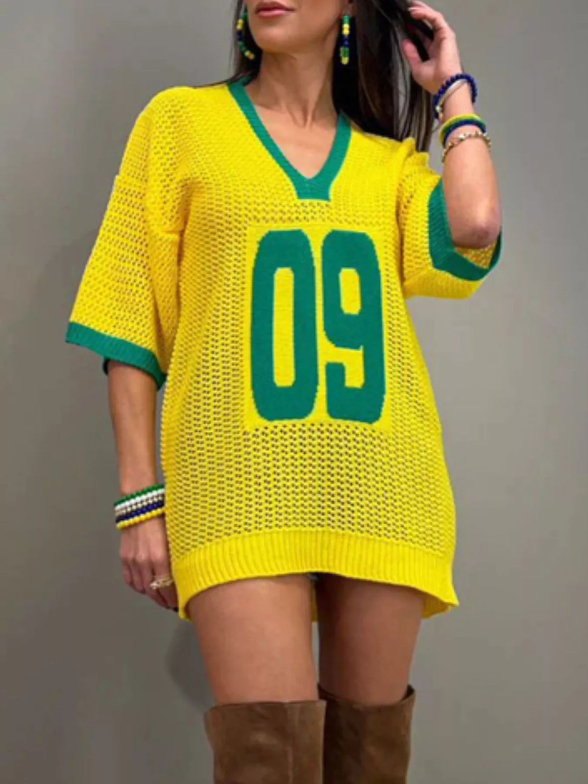 Women’s oversized V-neck openwork lightweight knit sweater by Plush Fashion Hub, featuring a relaxed fit and intricate knit pattern.