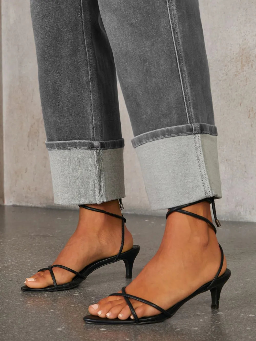 Trendsi high waisted straight-leg rolled denim jeans displayed on a model, showcasing classic blue denim and stylish fit