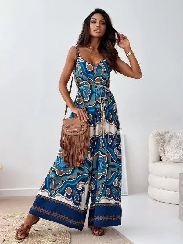 Printed spaghetti strap wide-leg jumpsuit by Plush Fashion Hub, featuring a stylish design and comfortable fit.