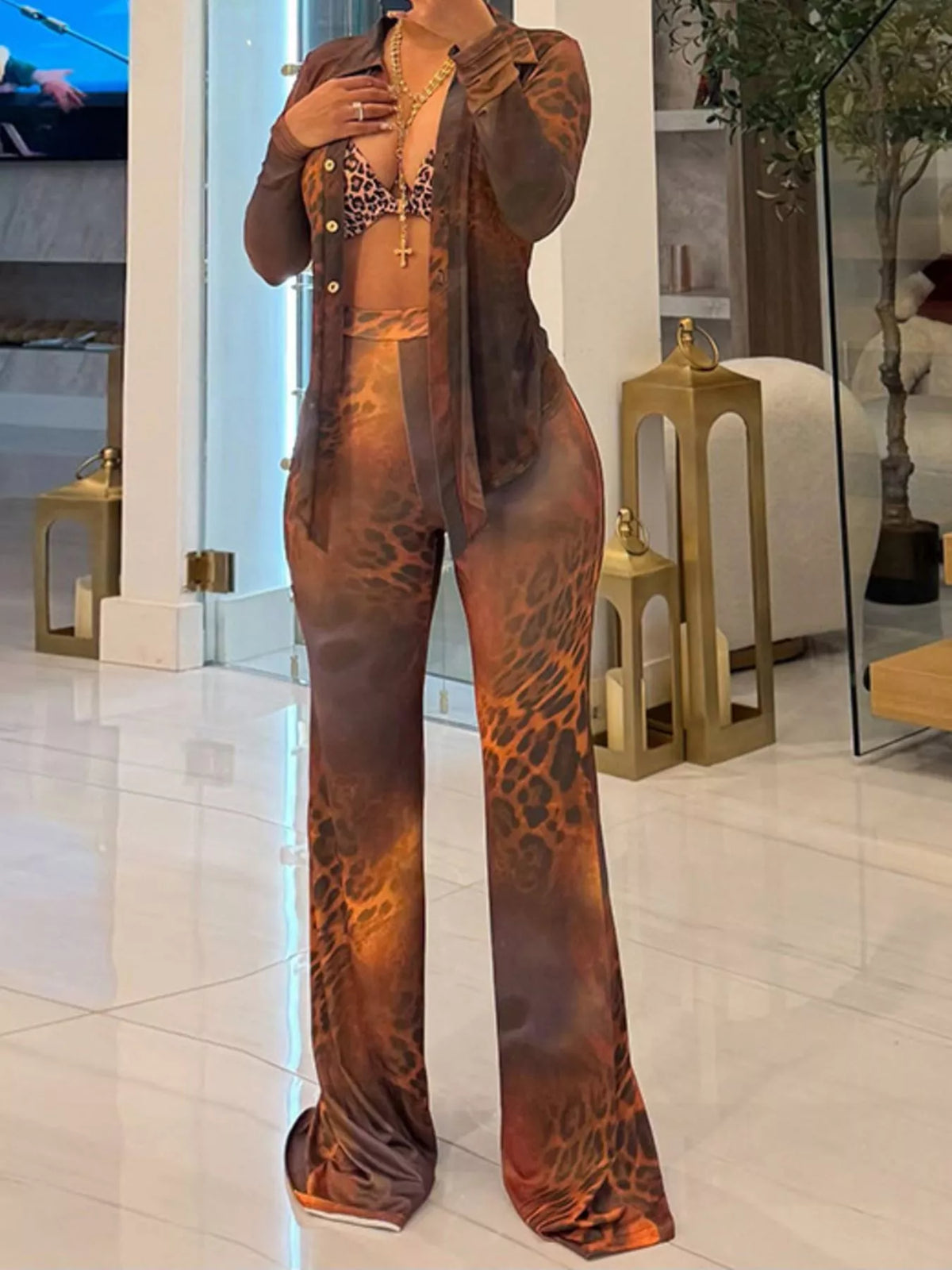 Printed mesh shirt and pants set for women by Trendsi, featuring lightweight, breathable fabric with stylish pattern details.