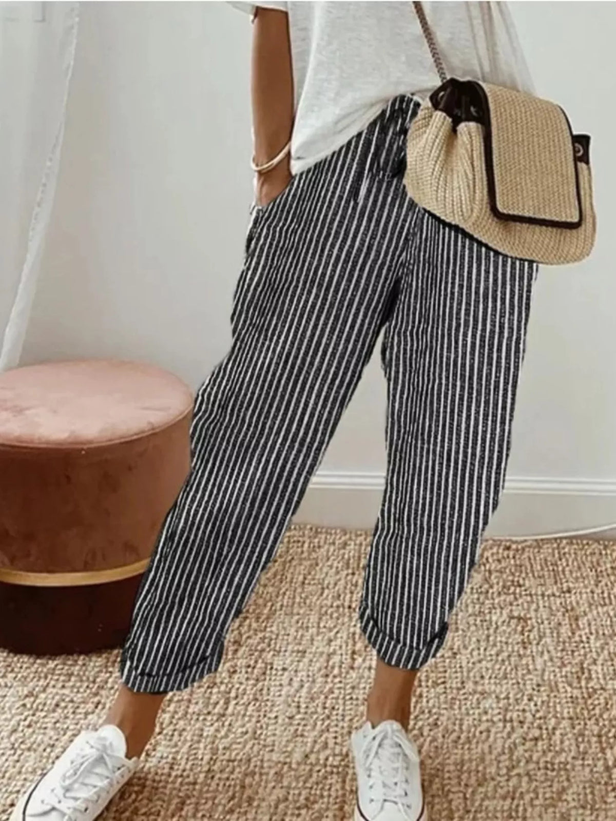 Striped cropped pants by Plush Fashion Hub featuring a stylish pattern and comfortable fit, shown in a well-lit studio setting.