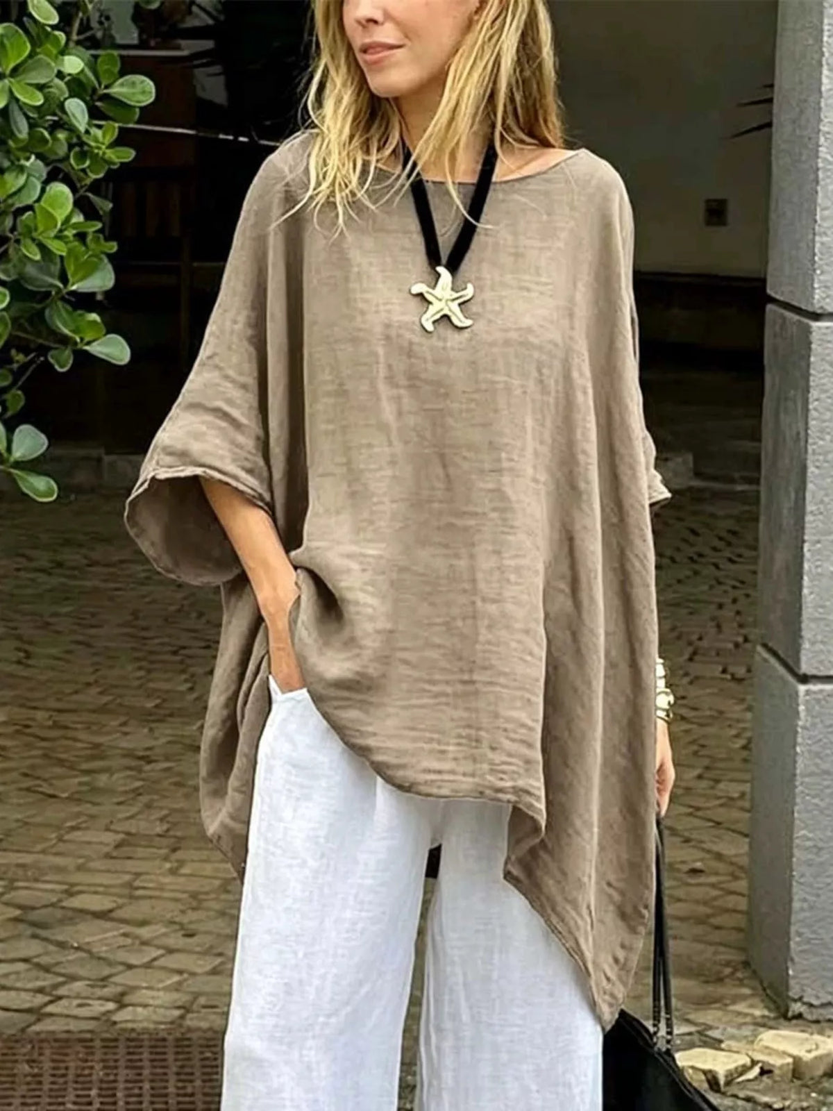Plus size loose fit asymmetrical hem tunic top by Plush Fashion Hub, featuring a flowing silhouette and stylish design.