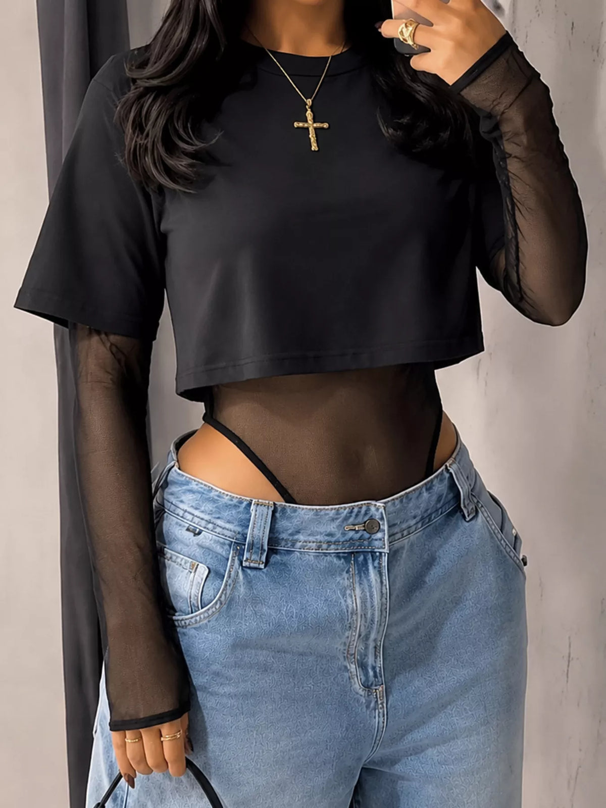Sheer mesh long sleeve bodysuit for women with fitted design, featuring see-through fabric and feminine style.
