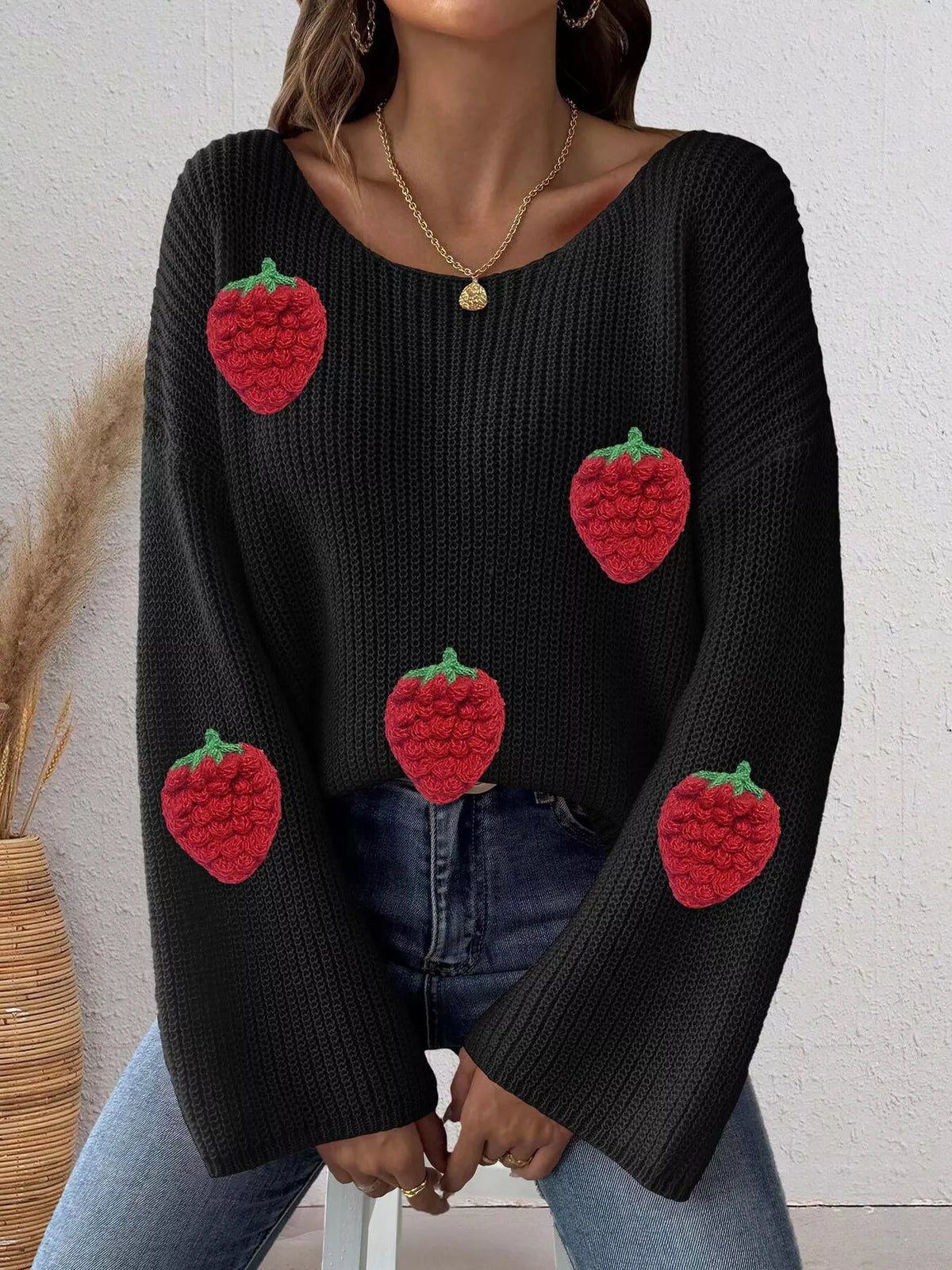Oversized sweater with strawberry applique from Trendsi, soft knit fabric, featuring colorful strawberry details on the front.