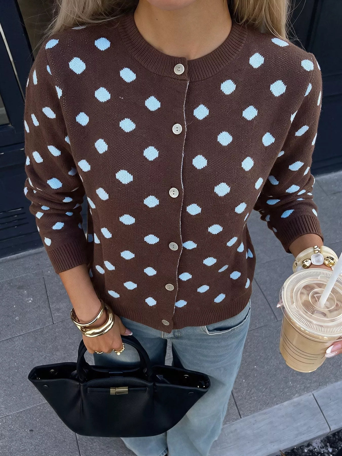 Women’s polka dot button-up cardigan by Trendsi, featuring a cozy knit fabric and classic design with white polka dots on a dark background.