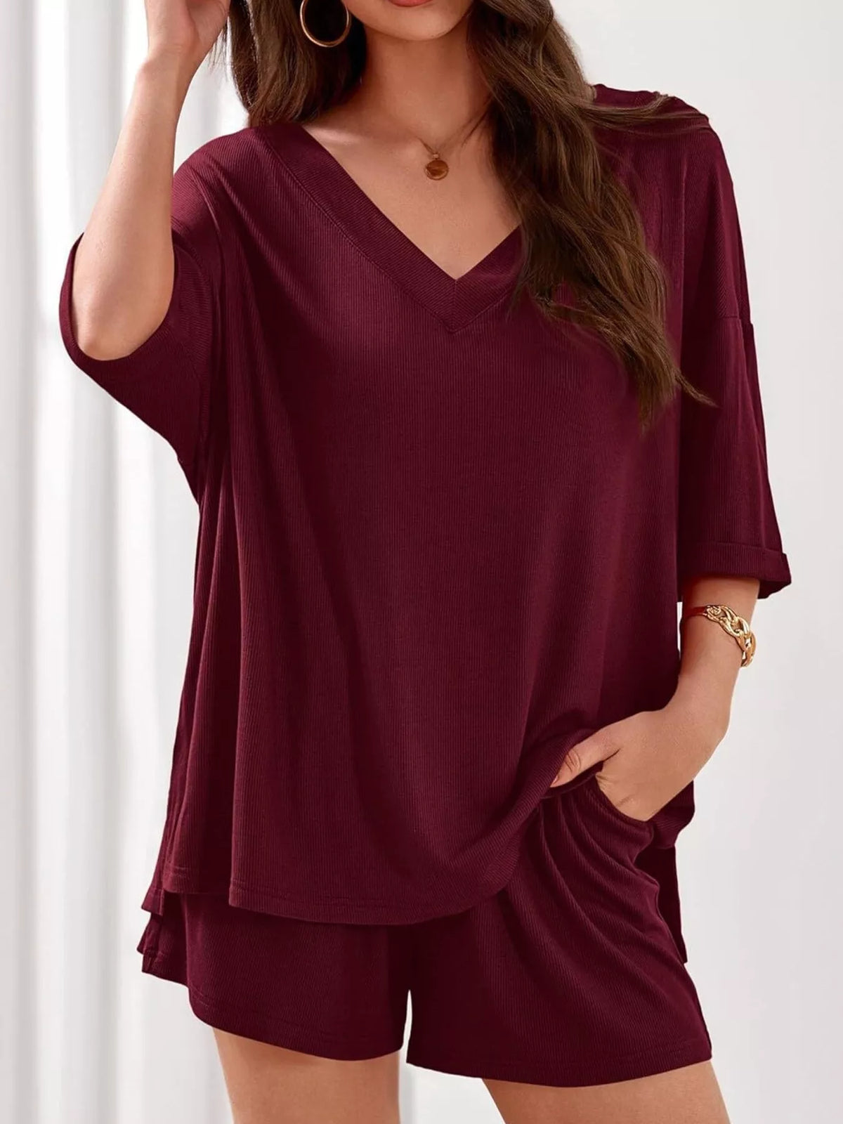 Women's casual V-neck top and shorts two-piece outfit by Plush Fashion Hub, solid color, comfortable clothing set for everyday wear.