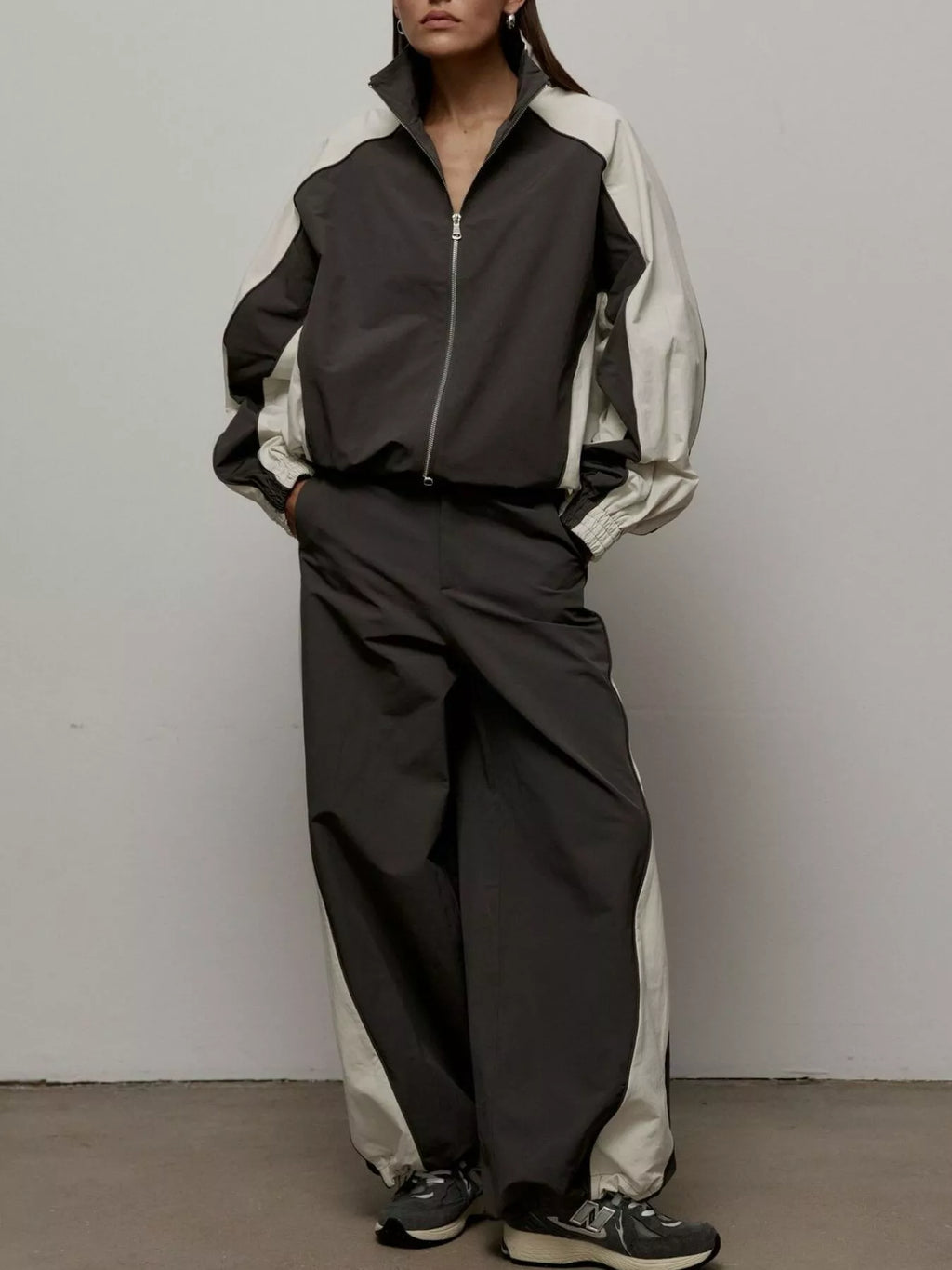 Color block zip-up outerwear and pants set from Trendsi, featuring vibrant color blocks and a sporty, casual style.
