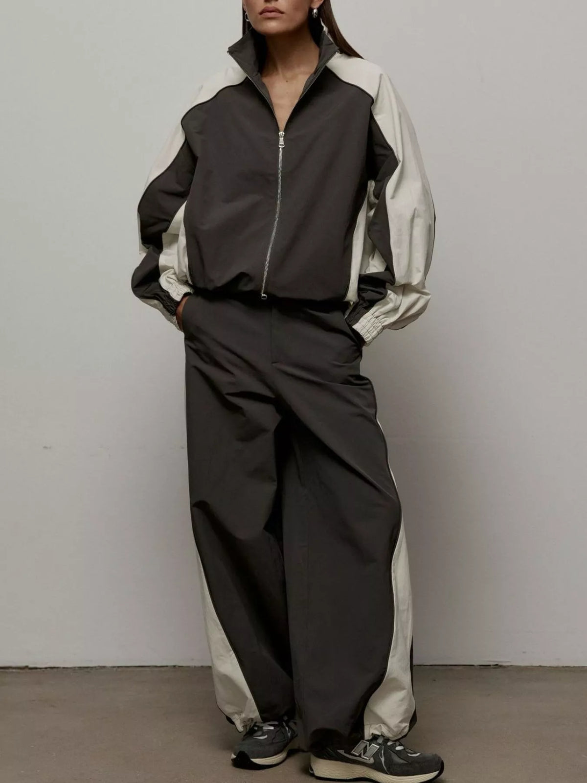Color block zip-up outerwear and pants set by Plush Fashion Hub, featuring vibrant color blocking and comfortable fit.