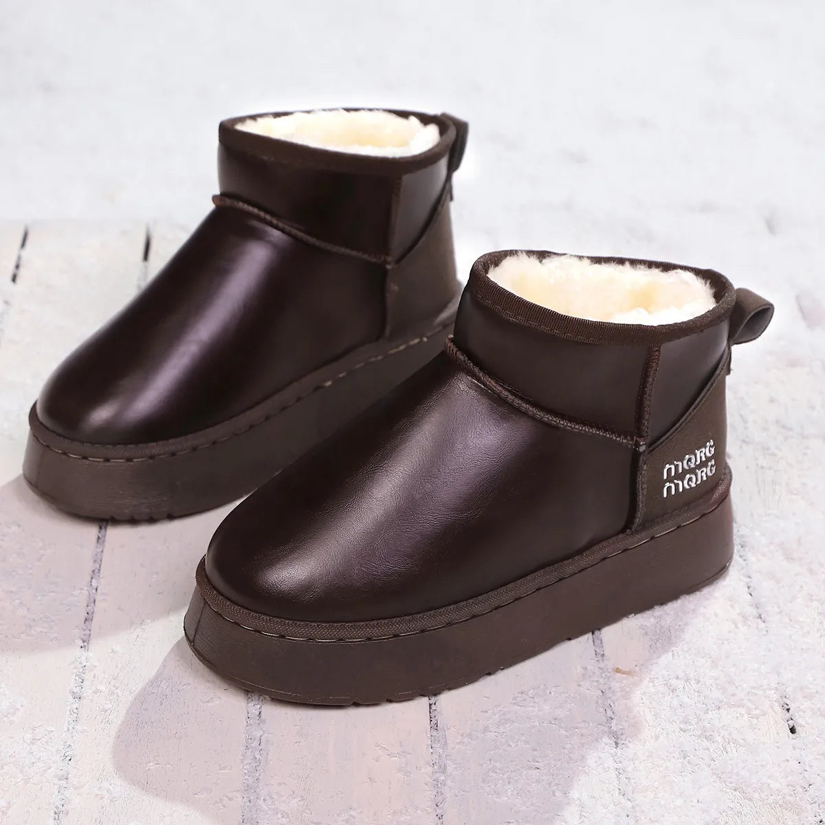 Faux-fur platform ankle boots from Trendsi with chunky heels and stylish design, shown in a side view.