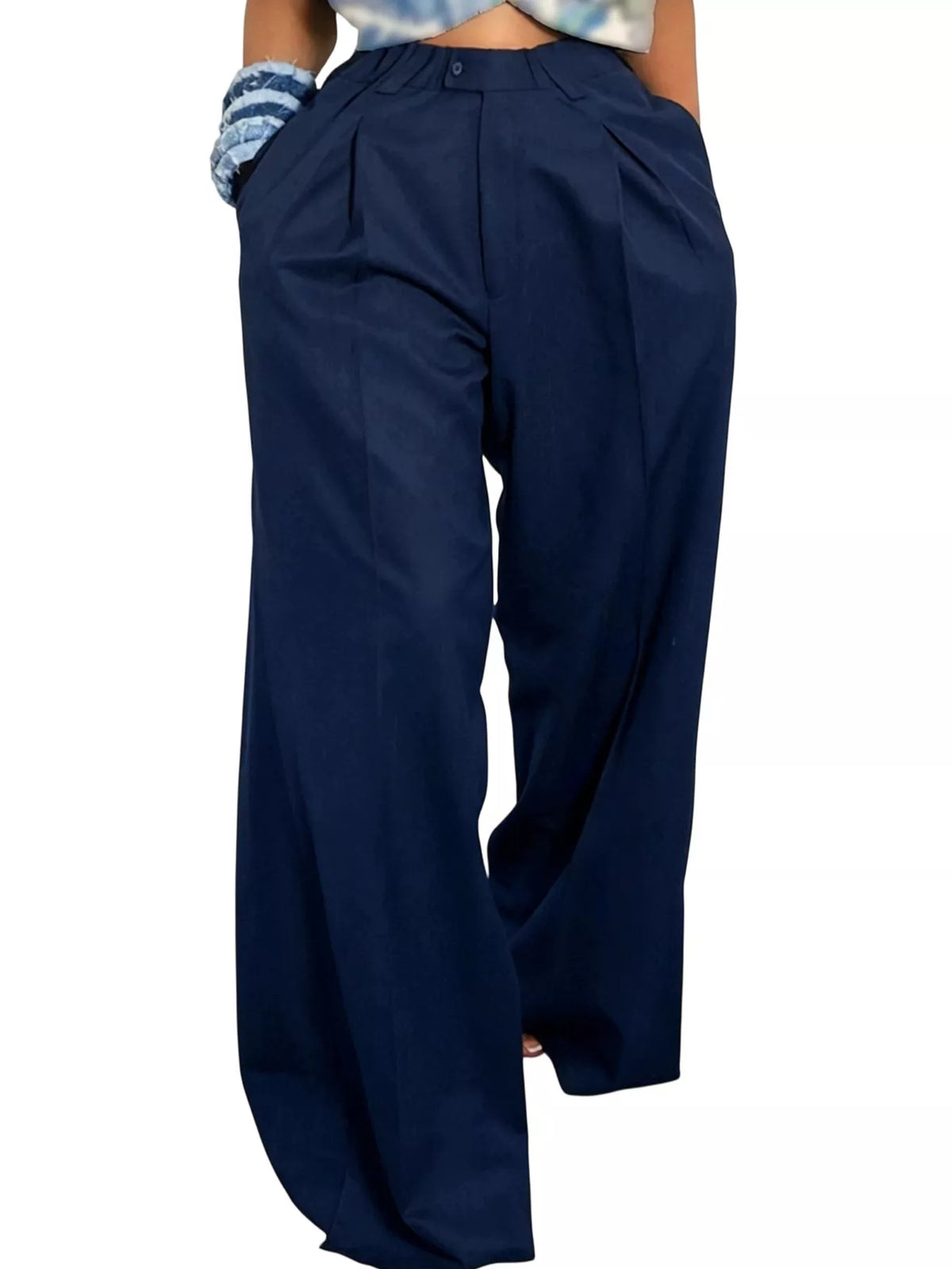 Wide leg pleated pants for women by Trendsi, featuring a flowy design and high waist, shown in a stylish, neutral fabric.