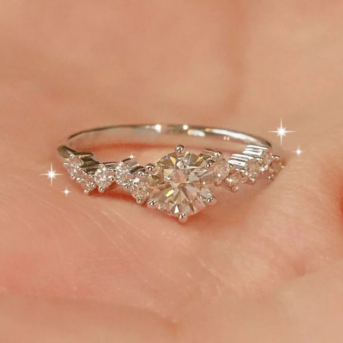 Sterling silver 2 carat moissanite ring with a sparkling center stone, featuring a sleek band and elegant design.