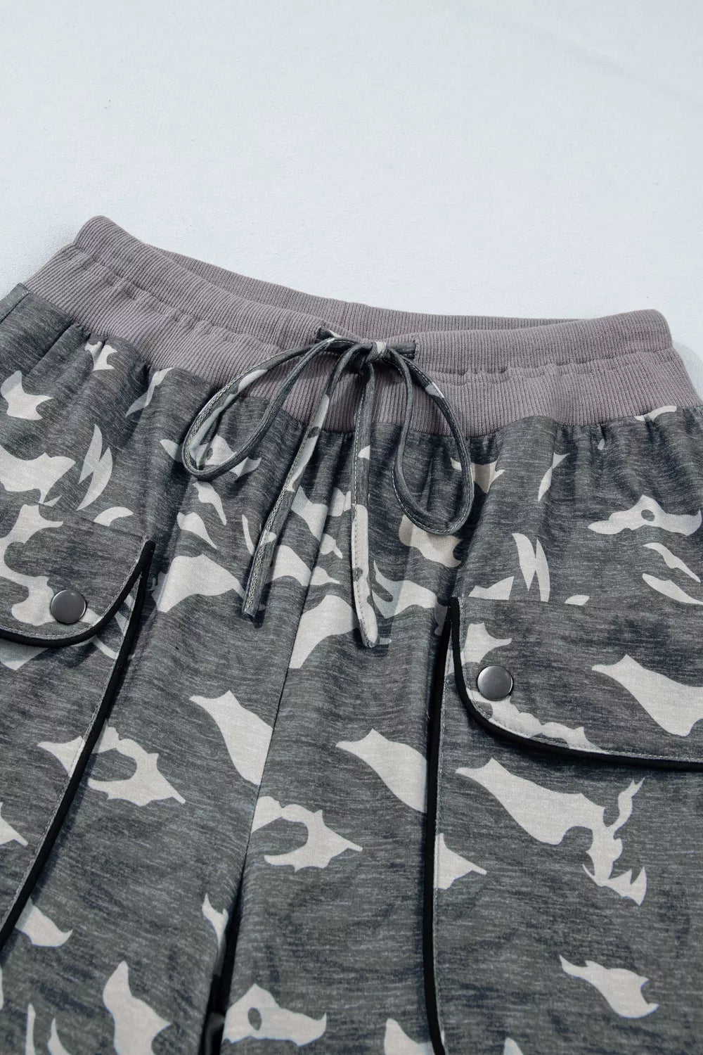 Multicolour camouflage cargo barrel pants with drawstring waist and contrast waistband by Plush Fashion Hub.