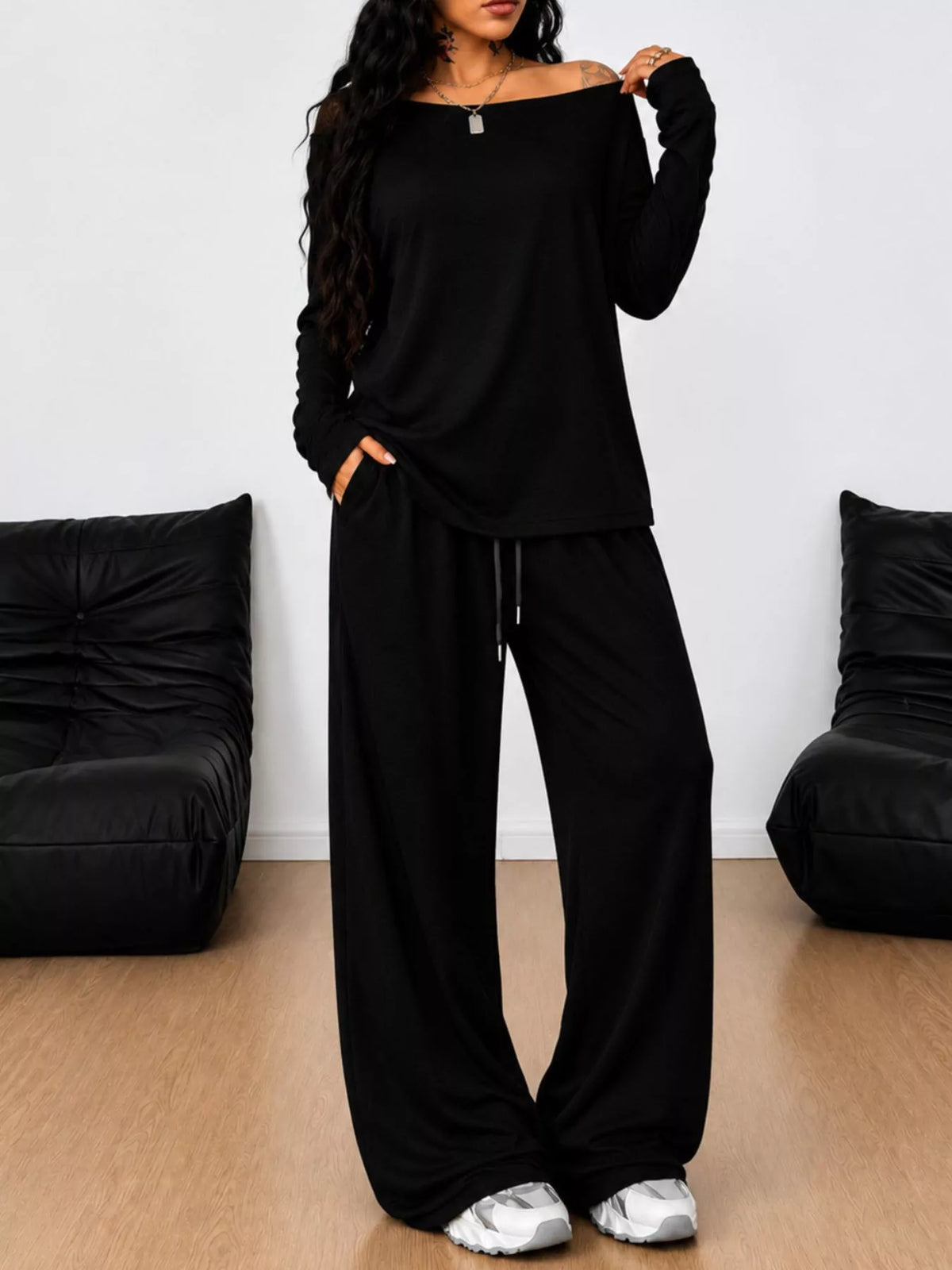 Plus size full size loose fit one-shoulder T-shirt and pants matching set by Trendsi, shown in a stylish, comfortable outfit.