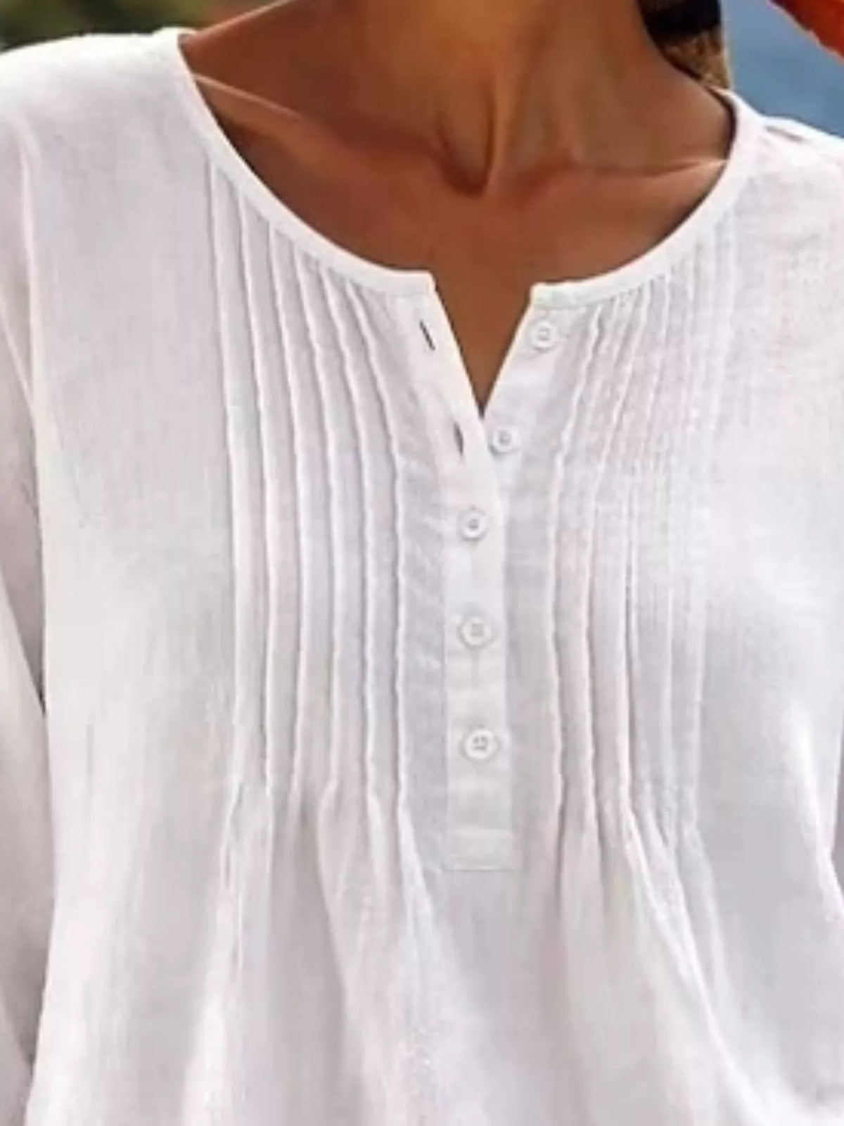 Casual long sleeve linen shirt with button details from Trendsi, featuring a relaxed fit and lightweight fabric.