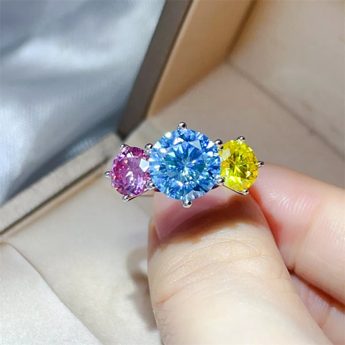 Sterling silver ring featuring a 5-carat moissanite gemstone, elegant jewelry piece with a polished finish.