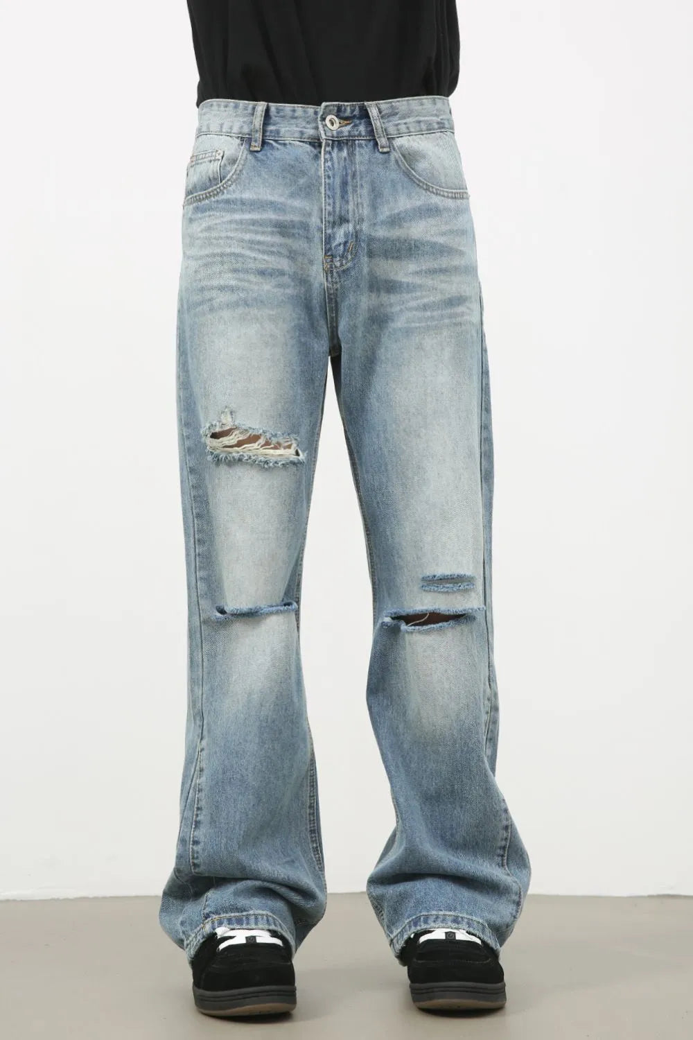 Men's distressed denim jeans by Plush Fashion Hub, showcasing ripped and faded details on classic blue denim fabric.