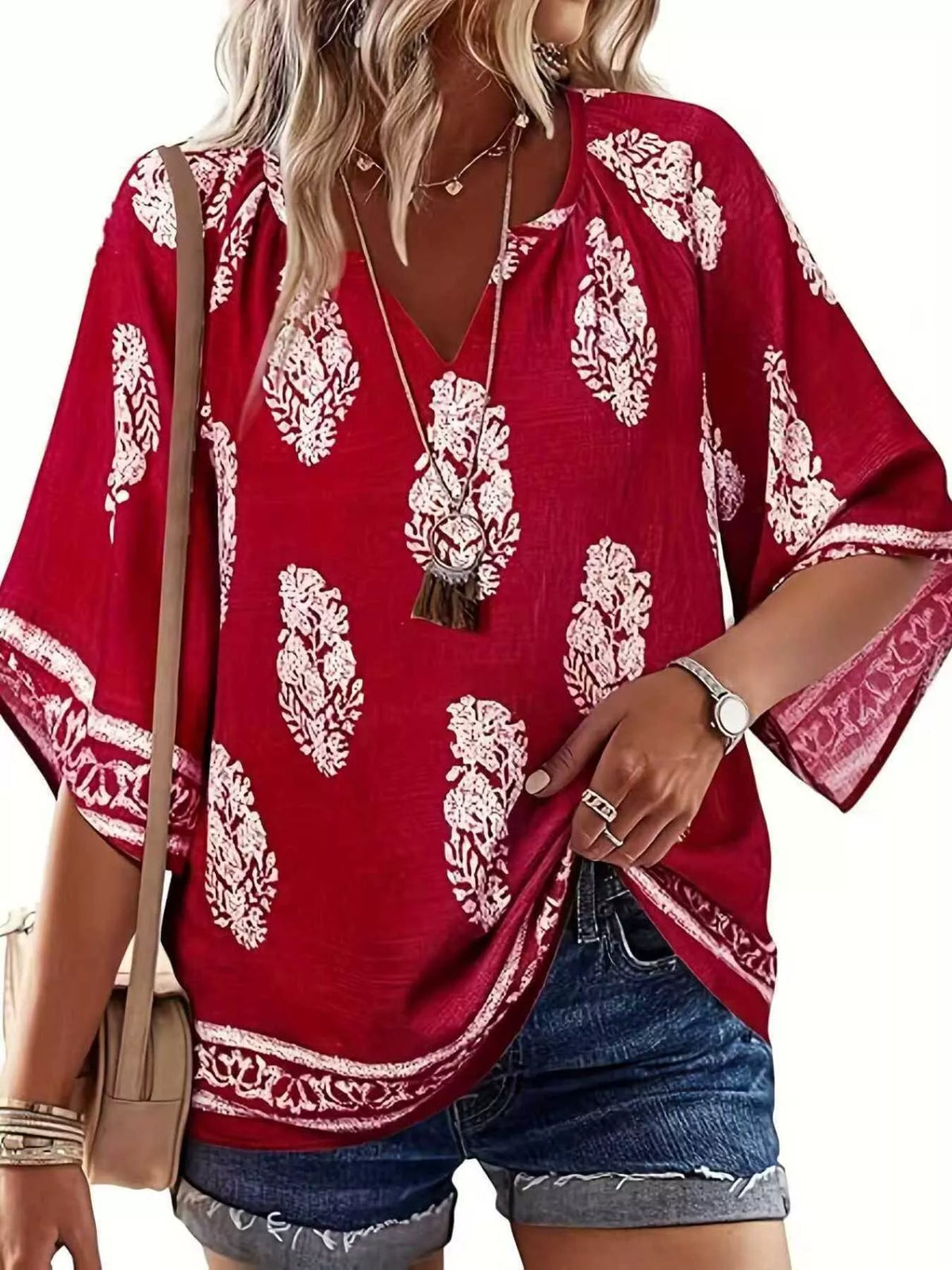 Printed notched 3/4 sleeve blouse from Plush Fashion Hub featuring a stylish design and comfortable fit.