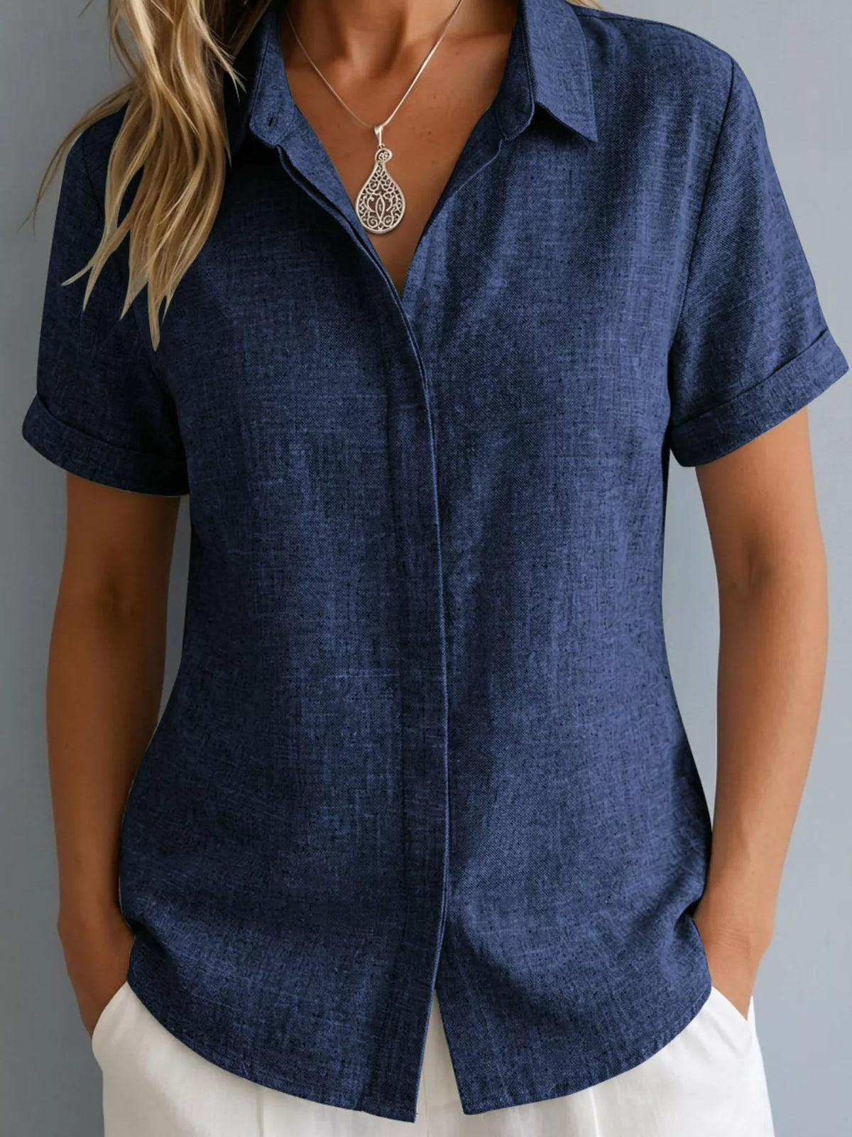Plus size collared short sleeve shirt from Trendsi, featuring a classic button-up design with a comfortable fit.