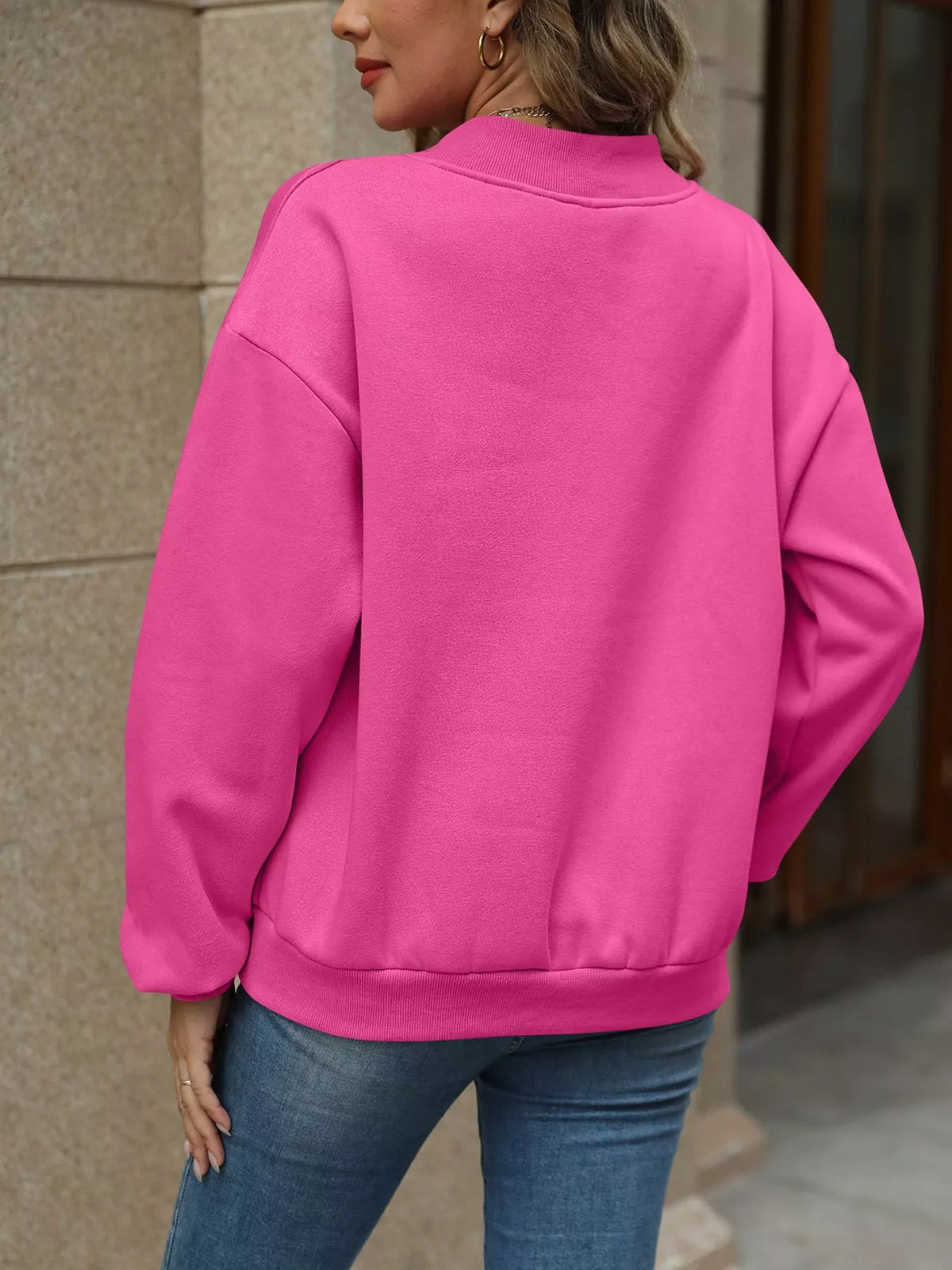 V-neck solid color casual sweatshirt by Trendsi, showing a comfortable fit and soft fabric in a neutral hue.