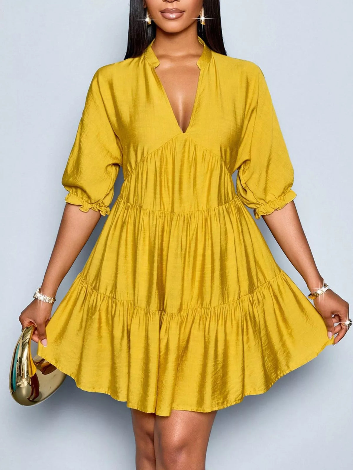 Notched half sleeve tiered dress by Plush Fashion Hub featuring a flowy design and layered fabric for a stylish look.