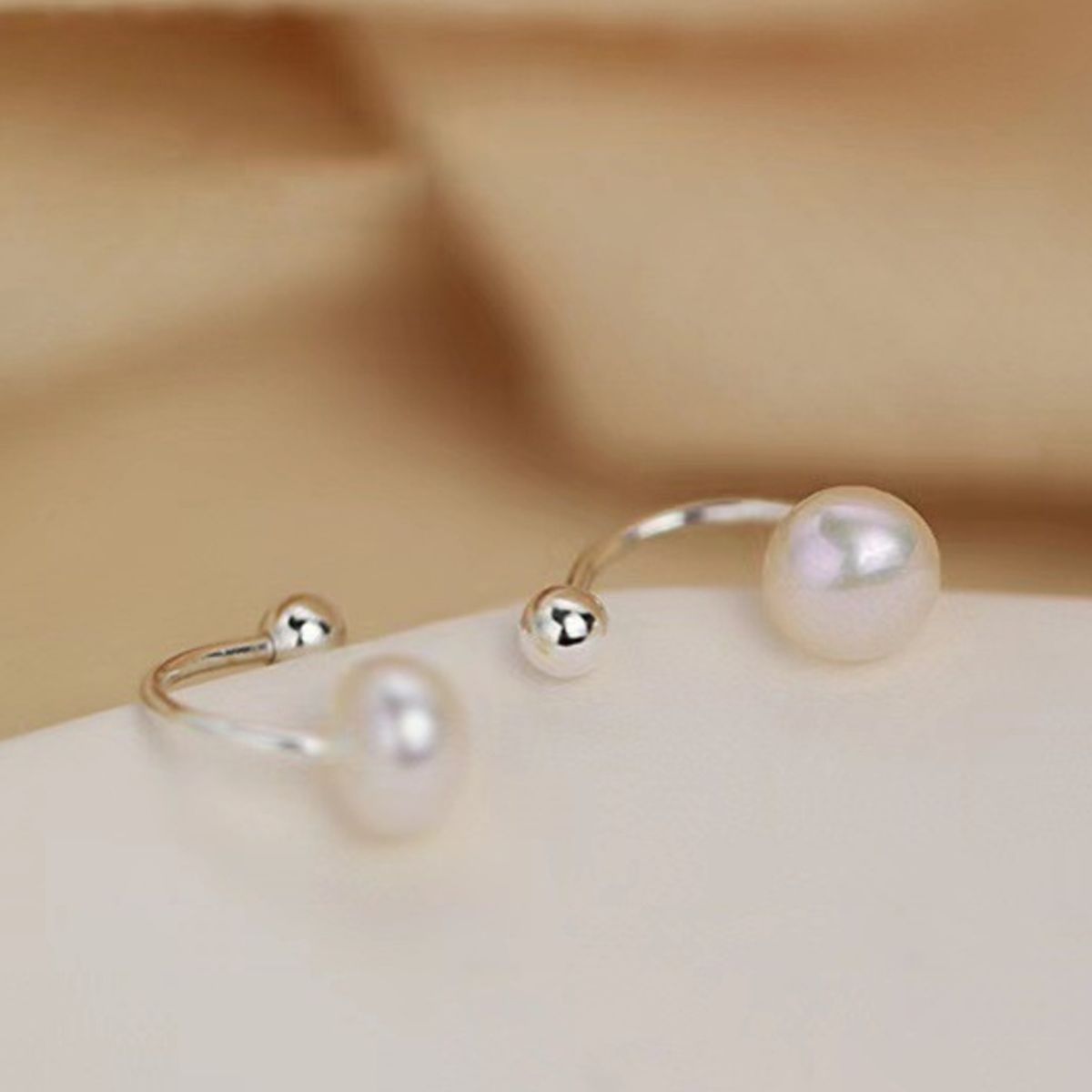 Sterling silver pearl stud earrings with round white pearls, elegant jewelry accessory for women from Plush Fashion Hub