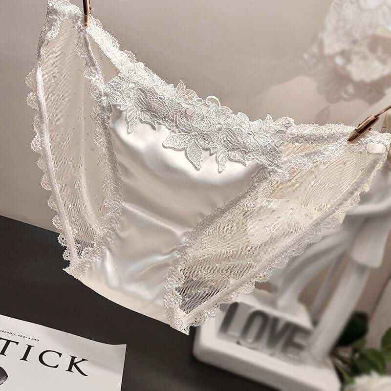 Mesh see-through low waist women's underwear in white lace design.