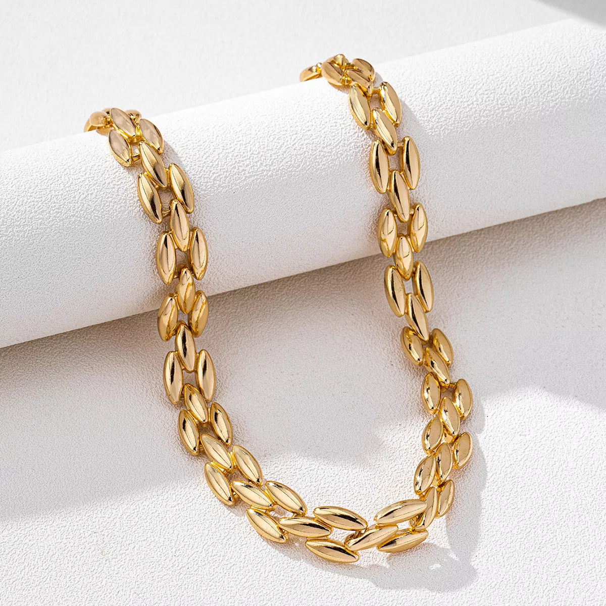 Gold-plated chunky necklace with bold links, featuring a shiny 18K gold finish, from Plush Fashion Hub.