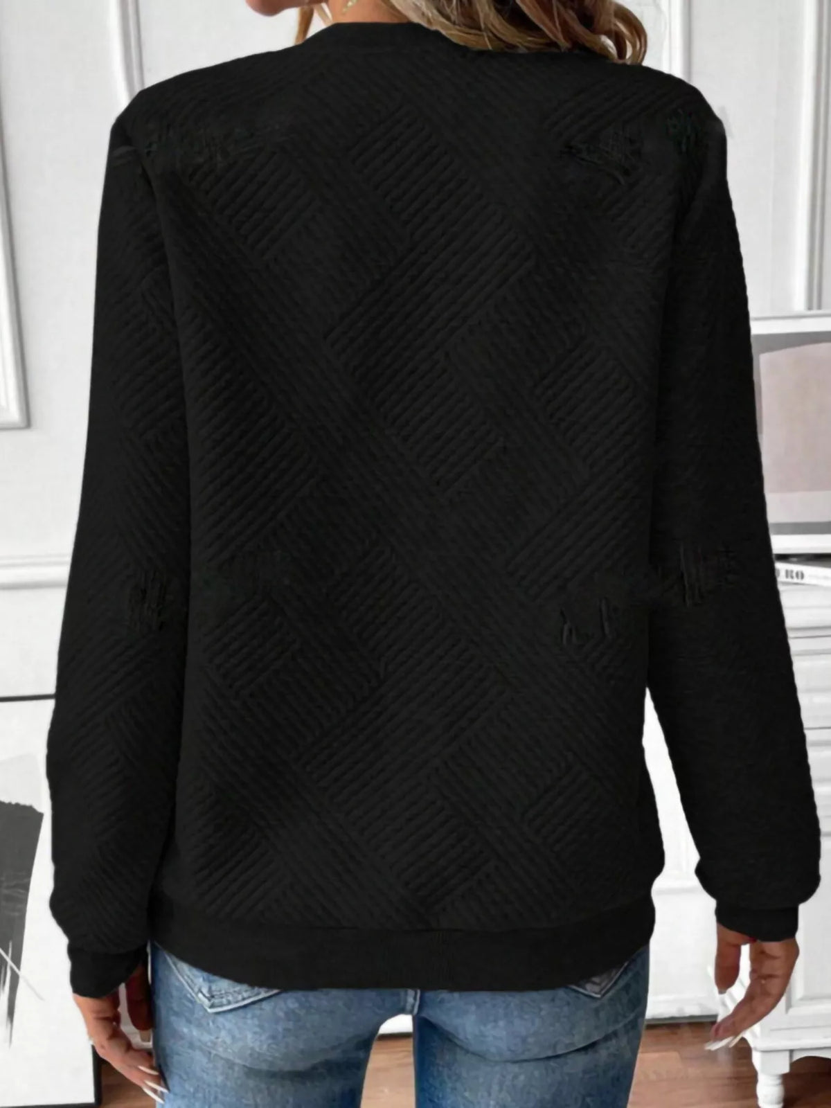 Textured women's quarter-zip sweatshirt by Trendsi, featuring a casual fit and soft fabric, shown in a close-up front view.