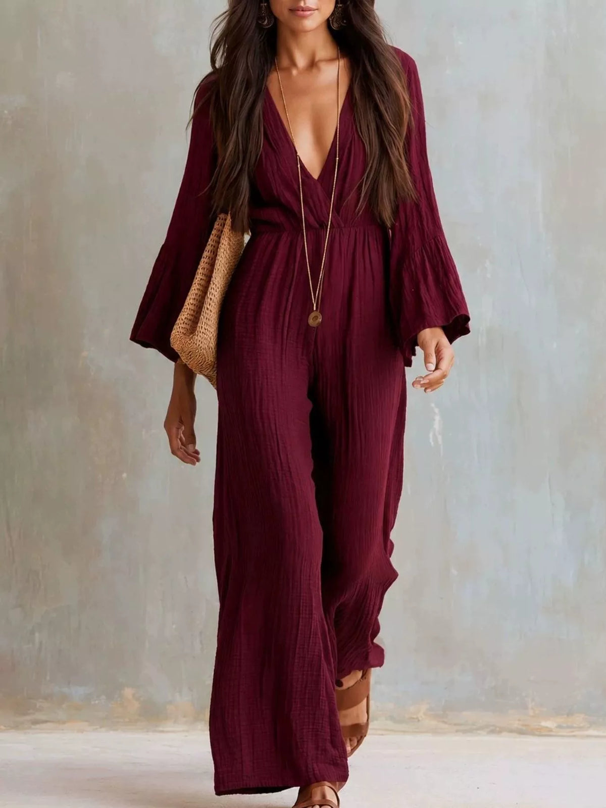 Textured flare sleeve jumpsuit for women by Trendsi, featuring a stylish design and comfortable fit, shown on a model.