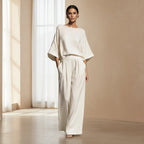 Women’s linen suit two-piece set with flared sleeves, casualwear by FitiqueFit, shown in a neutral-colored fabric on a model.