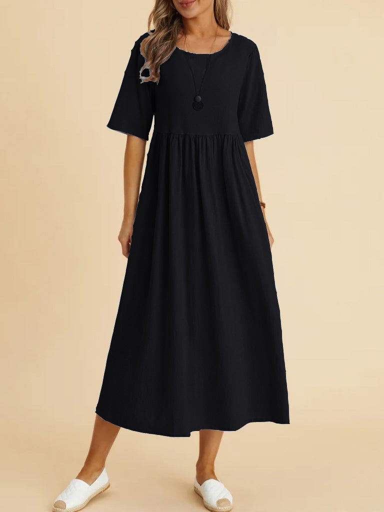 Plus size midi dress by FitiqueFit featuring a round neck and pockets, perfect for casual wear, shown in a relaxed fit style.
