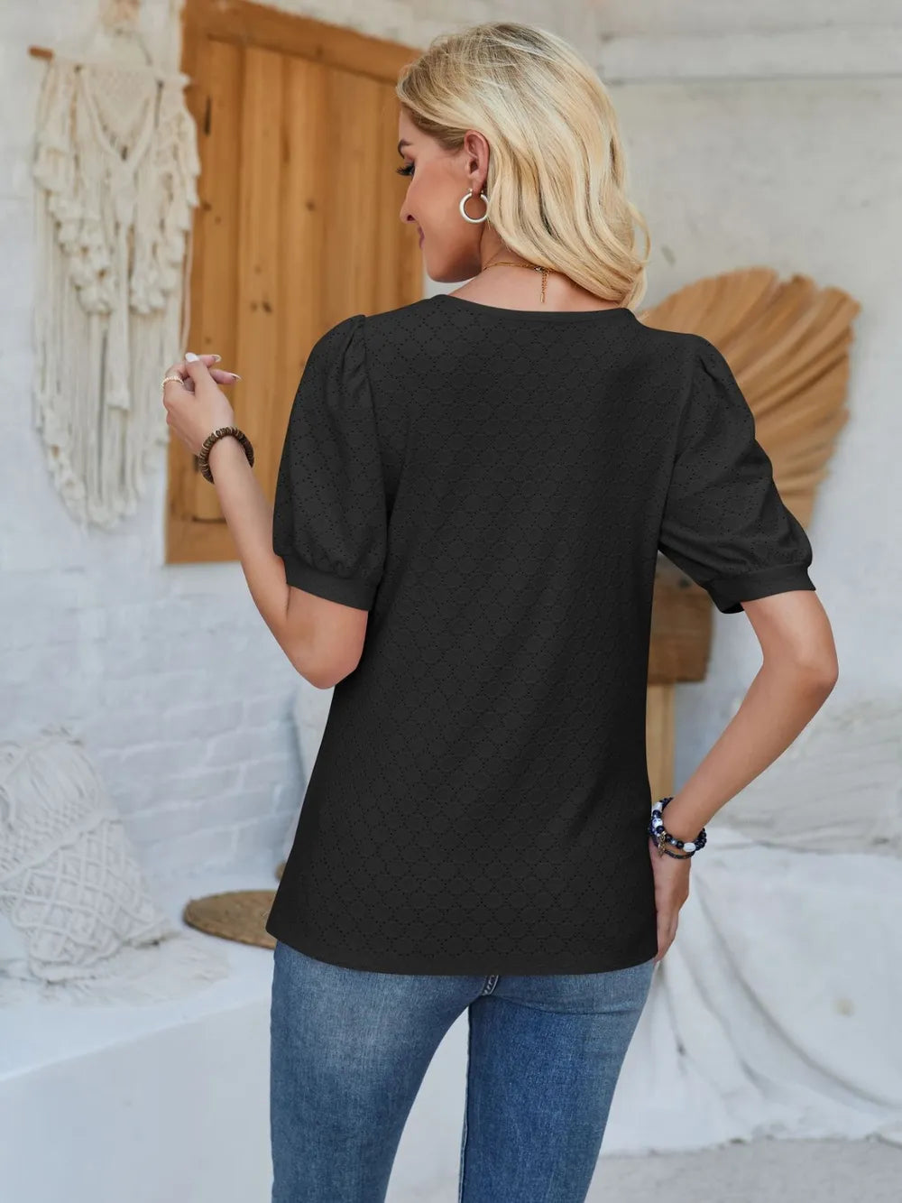 Asymmetrical neck short sleeve T-shirt with eyelet details, trendy Tops by Trendsi featuring stylish design and comfortable fit.