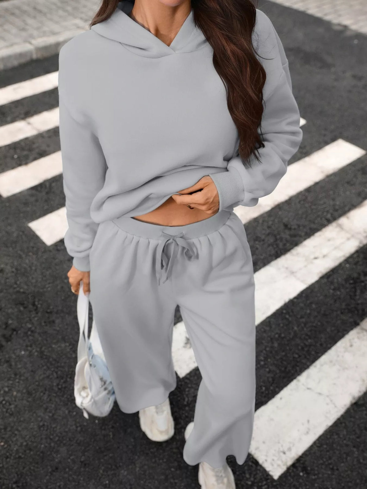 Trendsi women's hoodie and wide-leg pant set featuring a kangaroo pocket hoodie and comfortable matching pants.