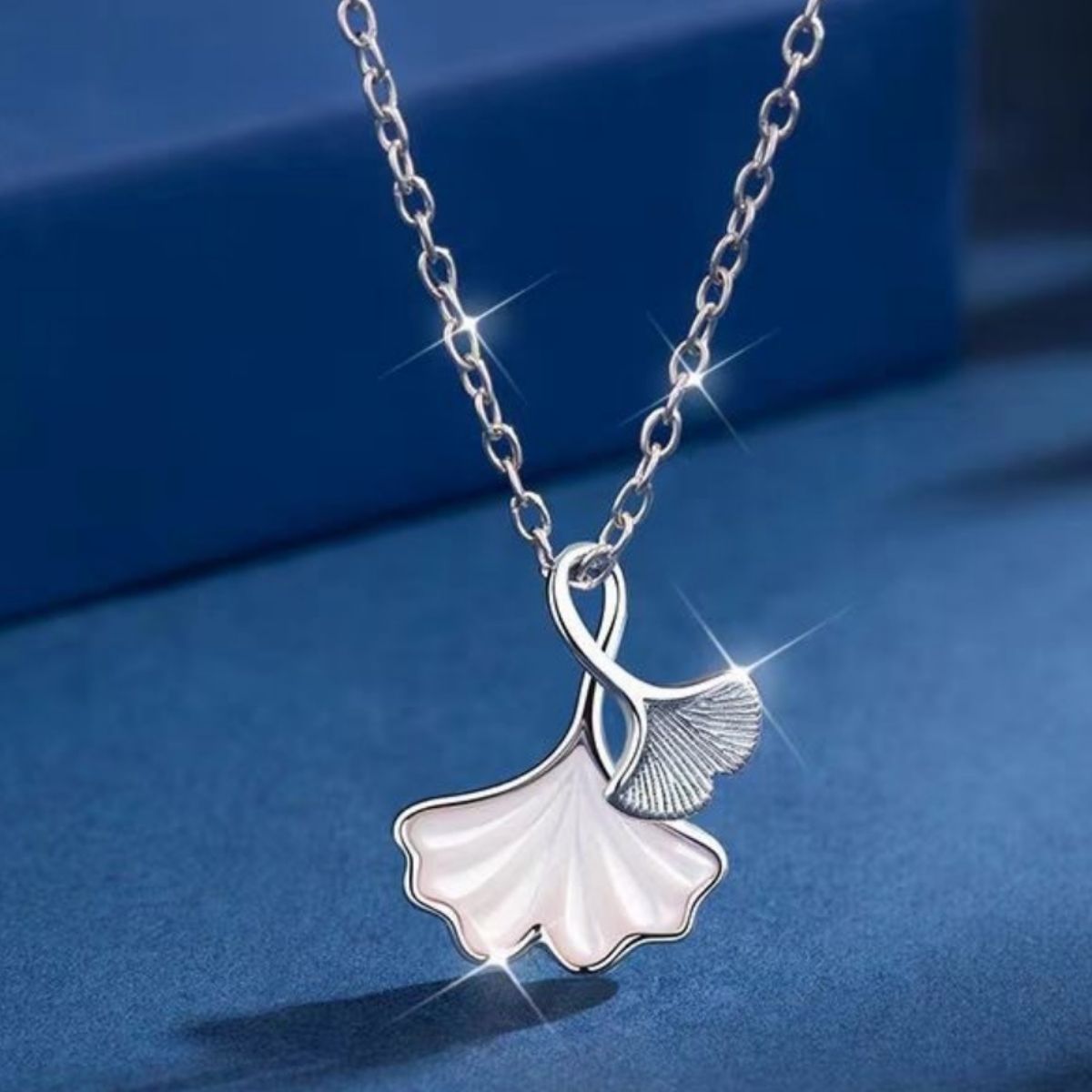 Ginkgo leaf pendant necklace by Plush Fashion Hub featuring a delicate gold-toned ginkgo leaf charm on a chain.