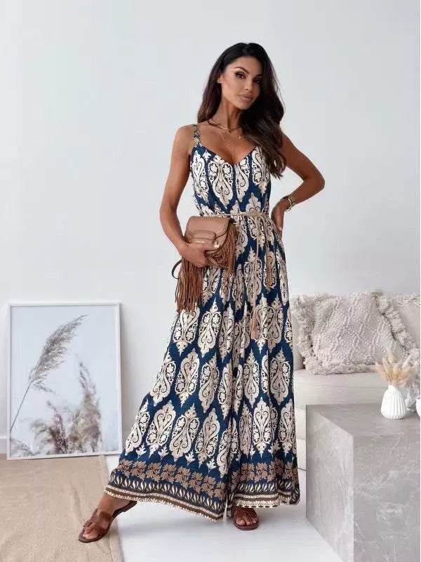 Printed spaghetti strap wide-leg jumpsuit by Plush Fashion Hub, featuring a stylish design and flowing wide-leg silhouette.