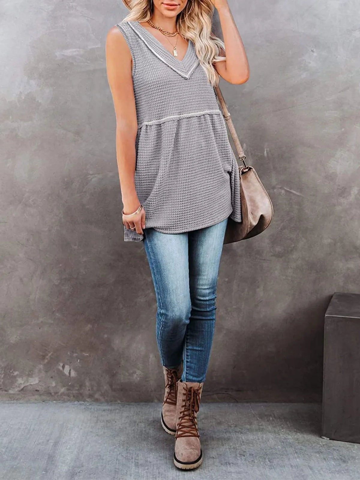 V-neck waffle knit tank top with contrast stitching from Plush Fashion Hub, featuring a fitted sleeveless design and ribbed texture.