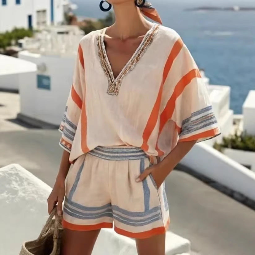 Women's V-neck top and shorts set by FitiqueFit, casualwear ensemble featuring a V-neck top and matching shorts.
