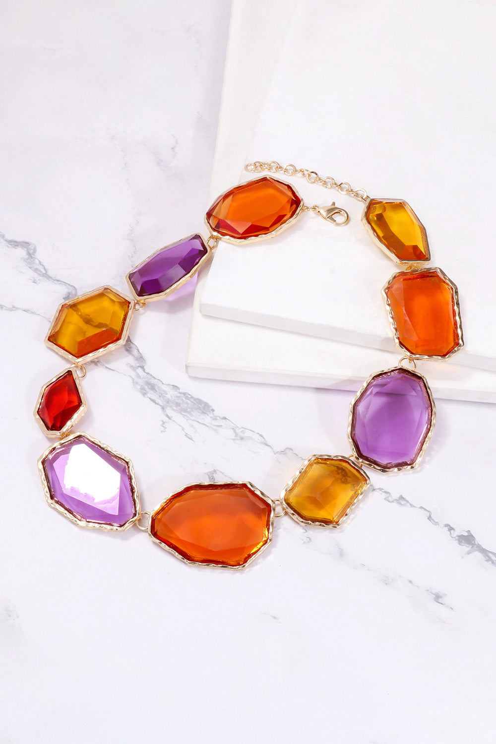 Geometrical shape resin necklace with zinc alloy frame, stylish jewelry from Plush Fashion Hub showing the detailed design.